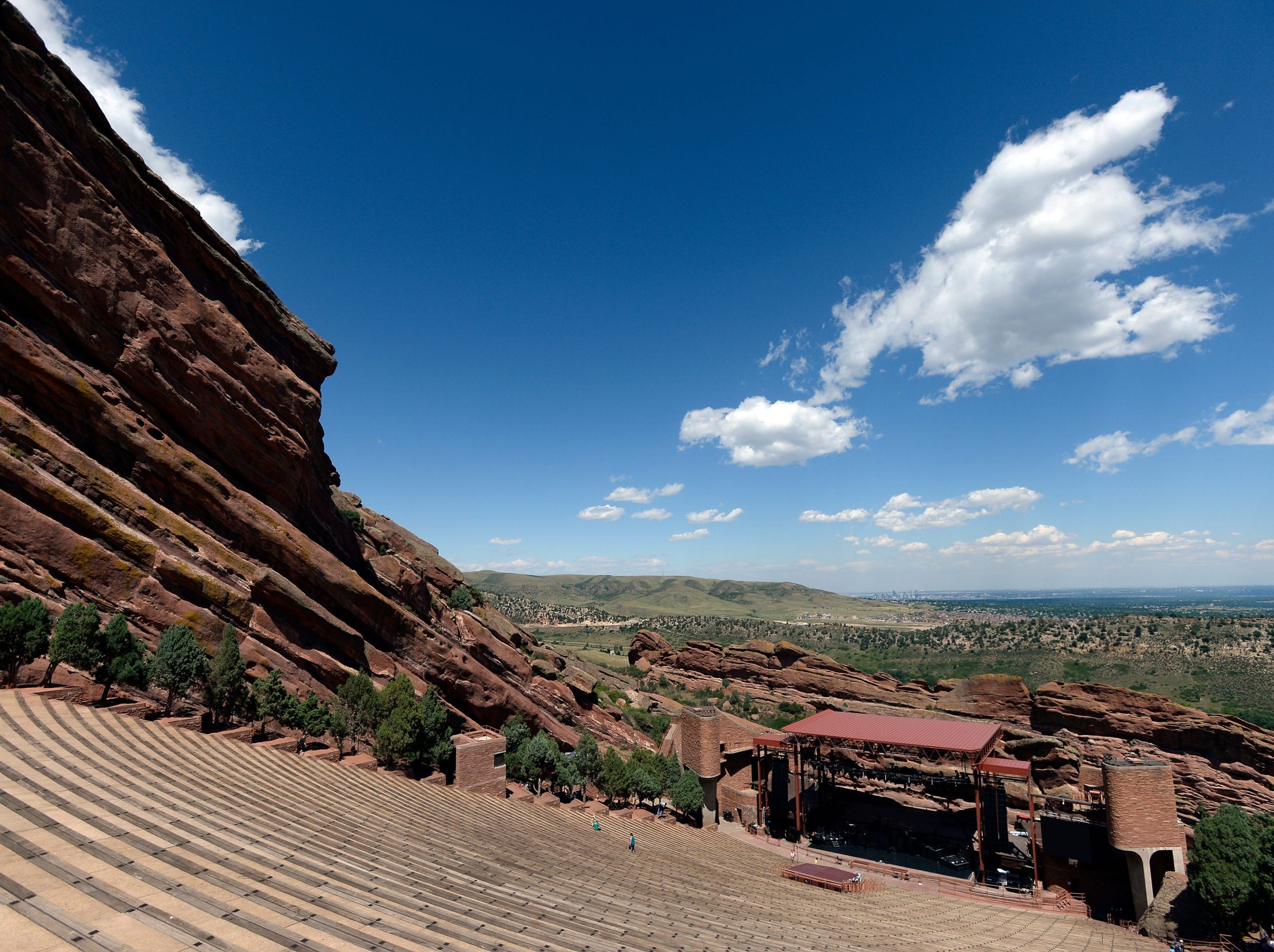 The empty amphitheater at Red Rocks with views of the mountains.
