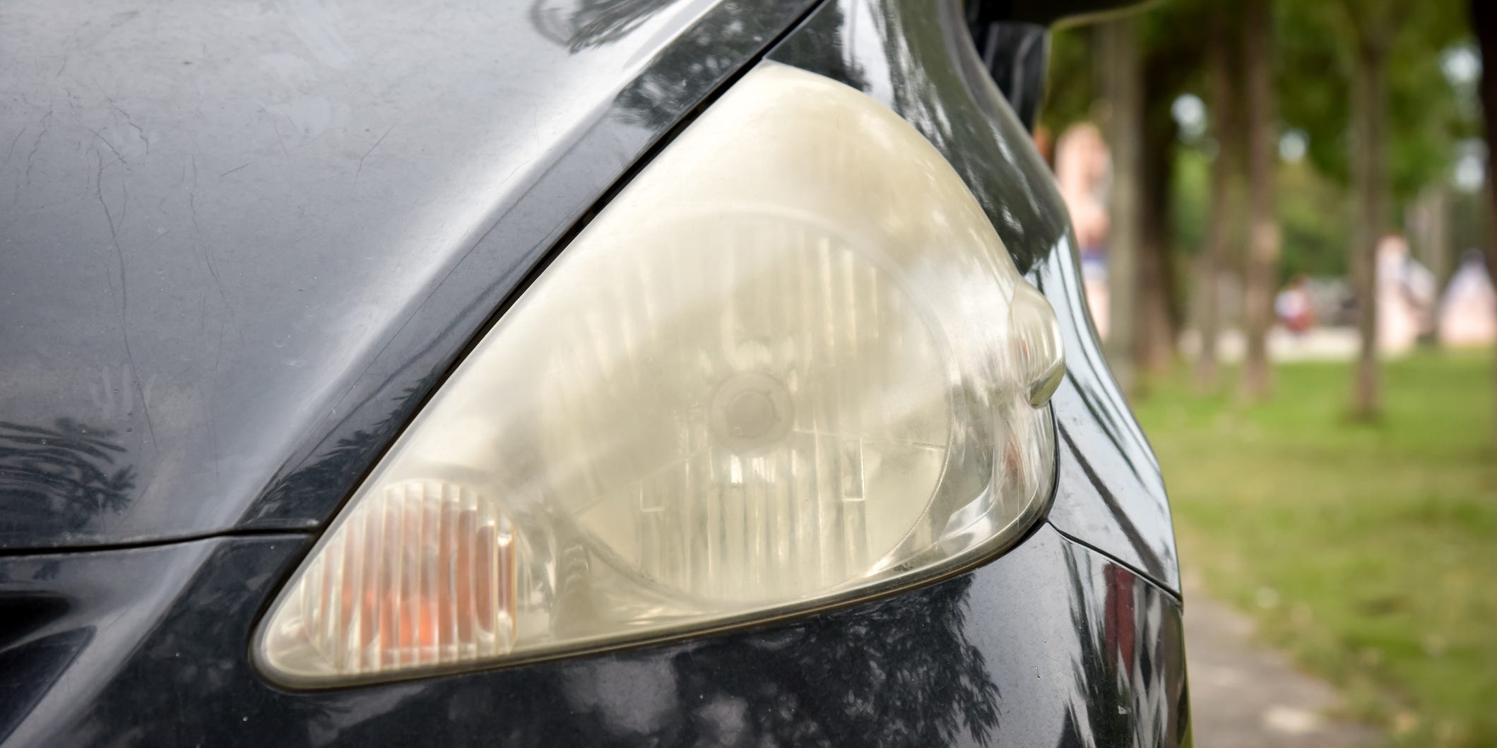 A closeup of a foggy car headlight