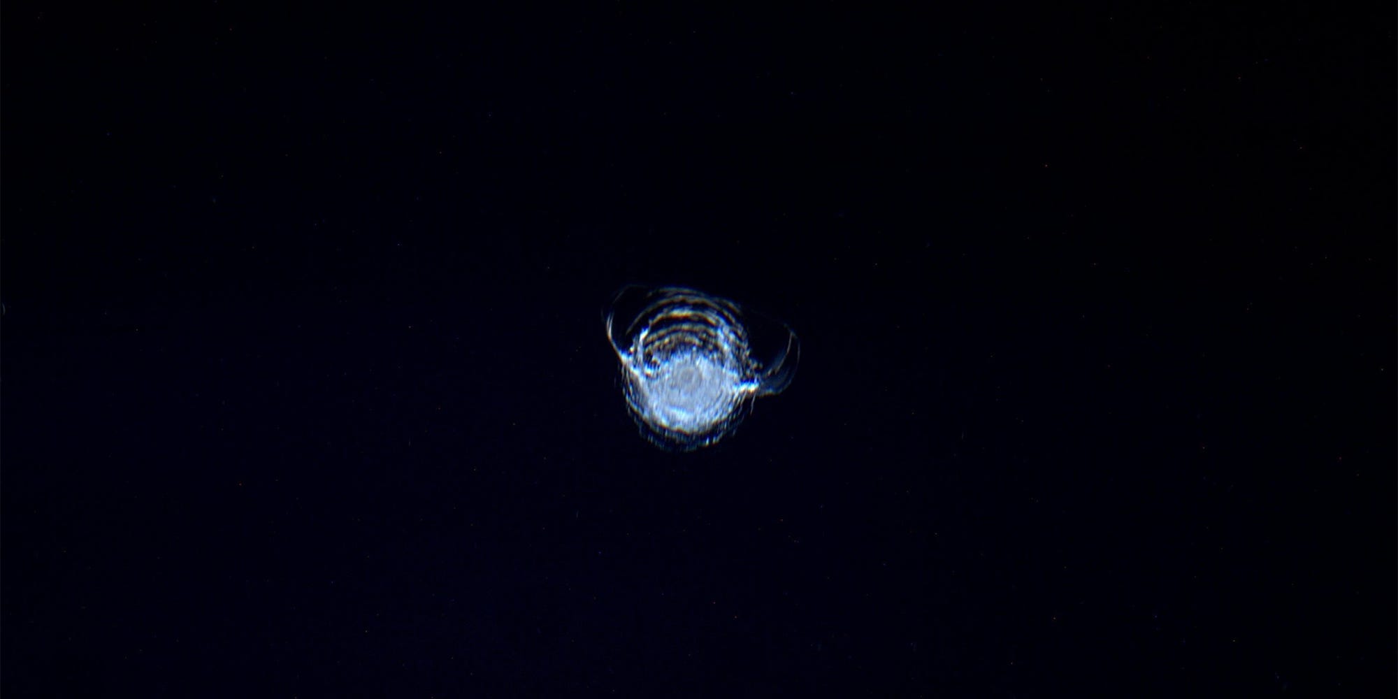 A chip in the ISS cupola taken by Astronaut Tim Peake is seen on a dark background