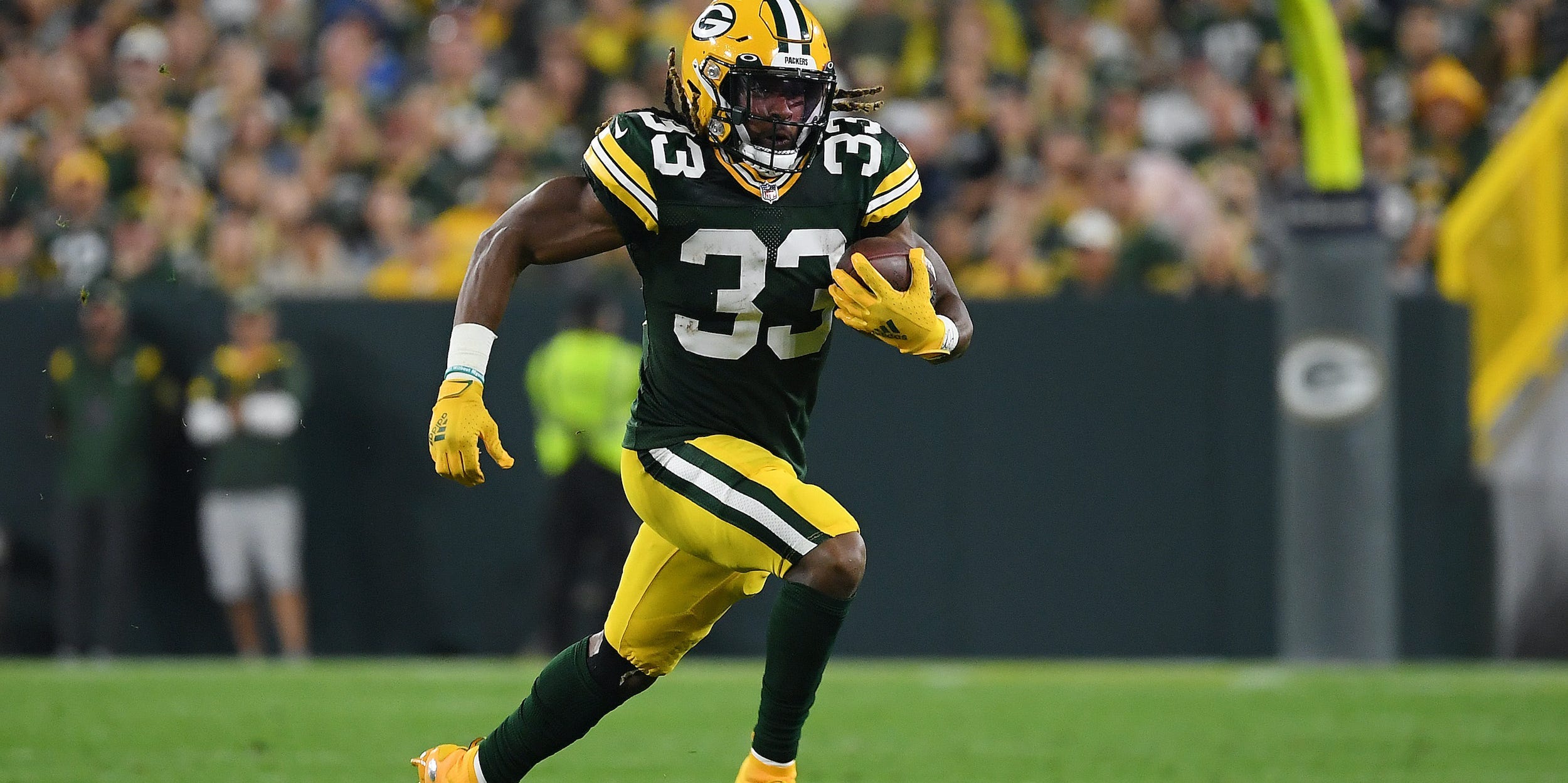 Aaron Jones of the Green Bay Packers plays against the Detroit Lions.