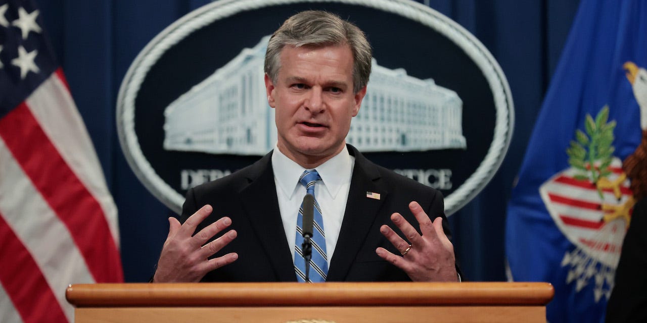 FBI Director Christopher Wray speaks during a news conference at the Robert F. Kennedy Main Justice Building on November 08, 2021 in Washington, DC.