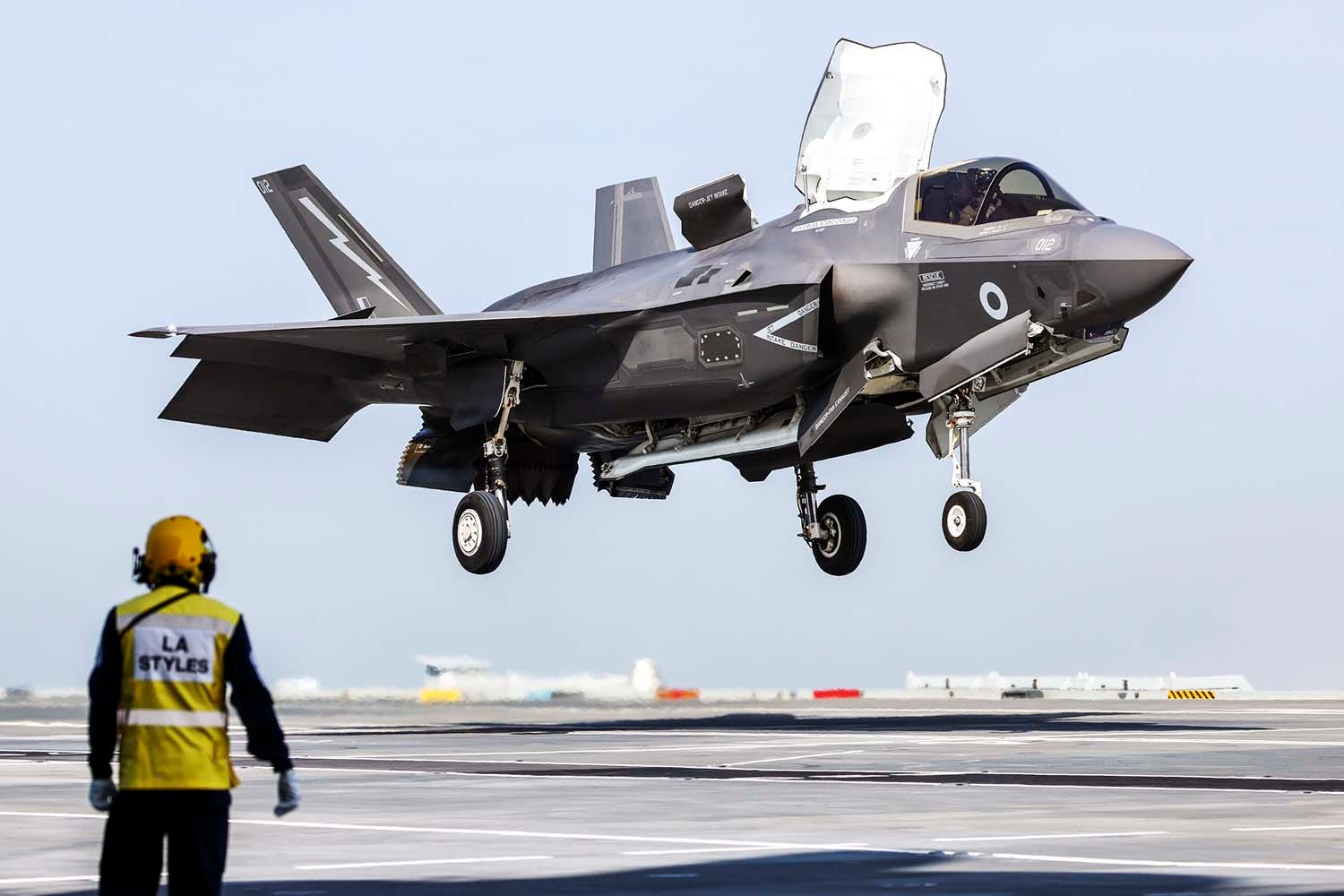 F-35 hovers over HMS Prince of Wales