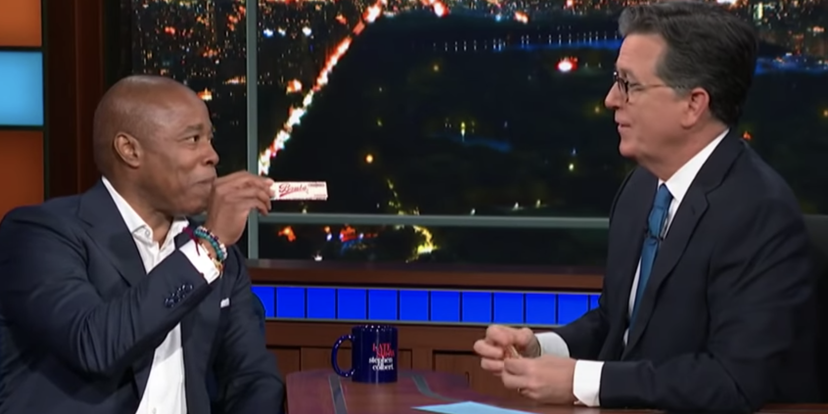 New York City Mayor-elect Eric Adams hands "Late Show" host Stephen Colbert a packet of rolling papers.