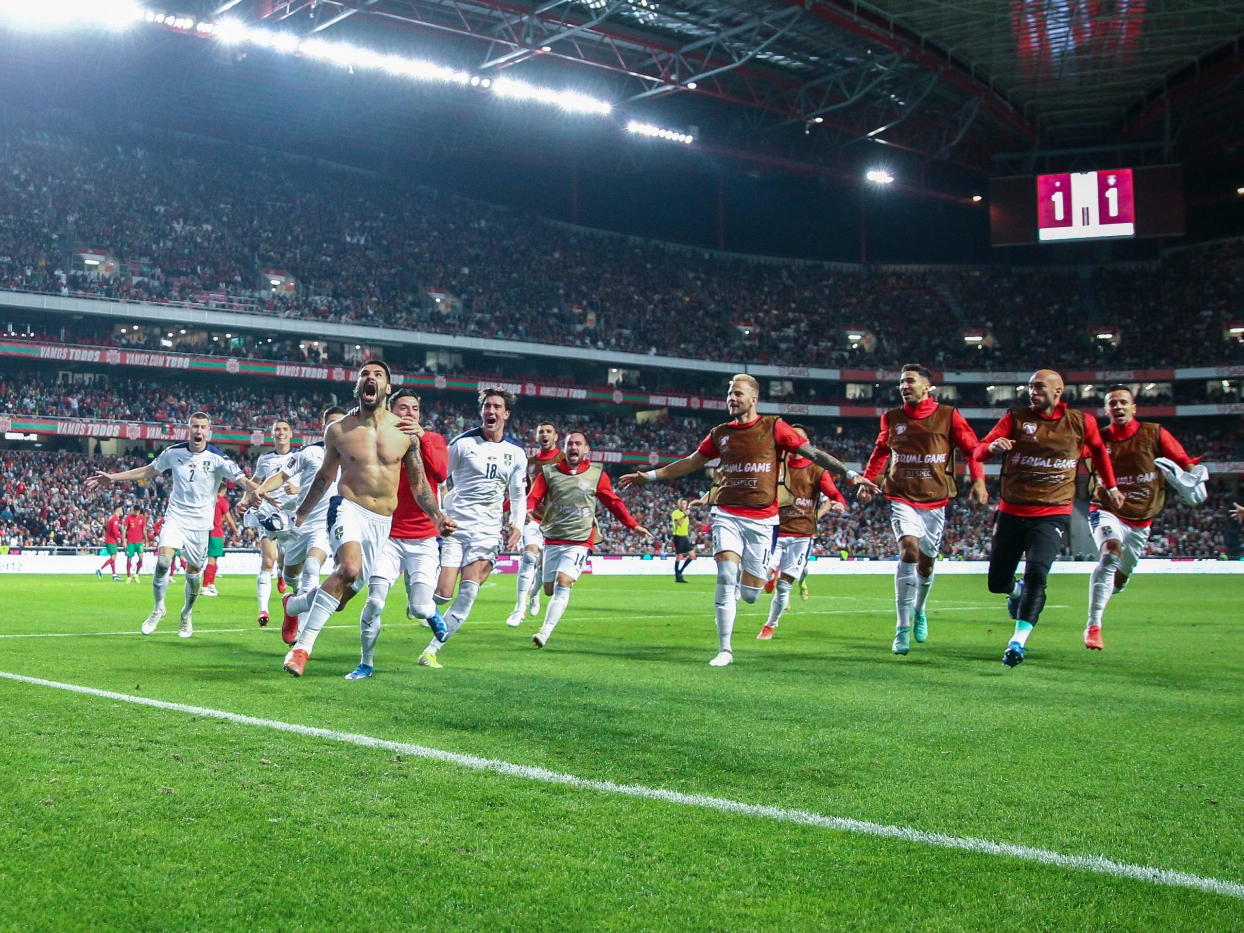 Serbian players celebrate a goal.