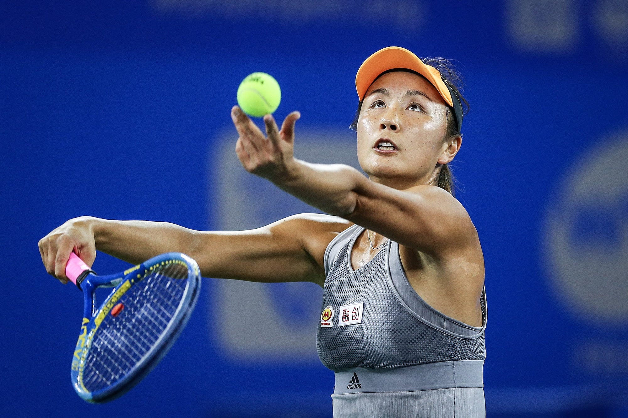 Shuai Peng of China severs during the match against Garbine Muguruza of Spain on Day 2 of 2019 Dongfeng Motor Wuhan Open
