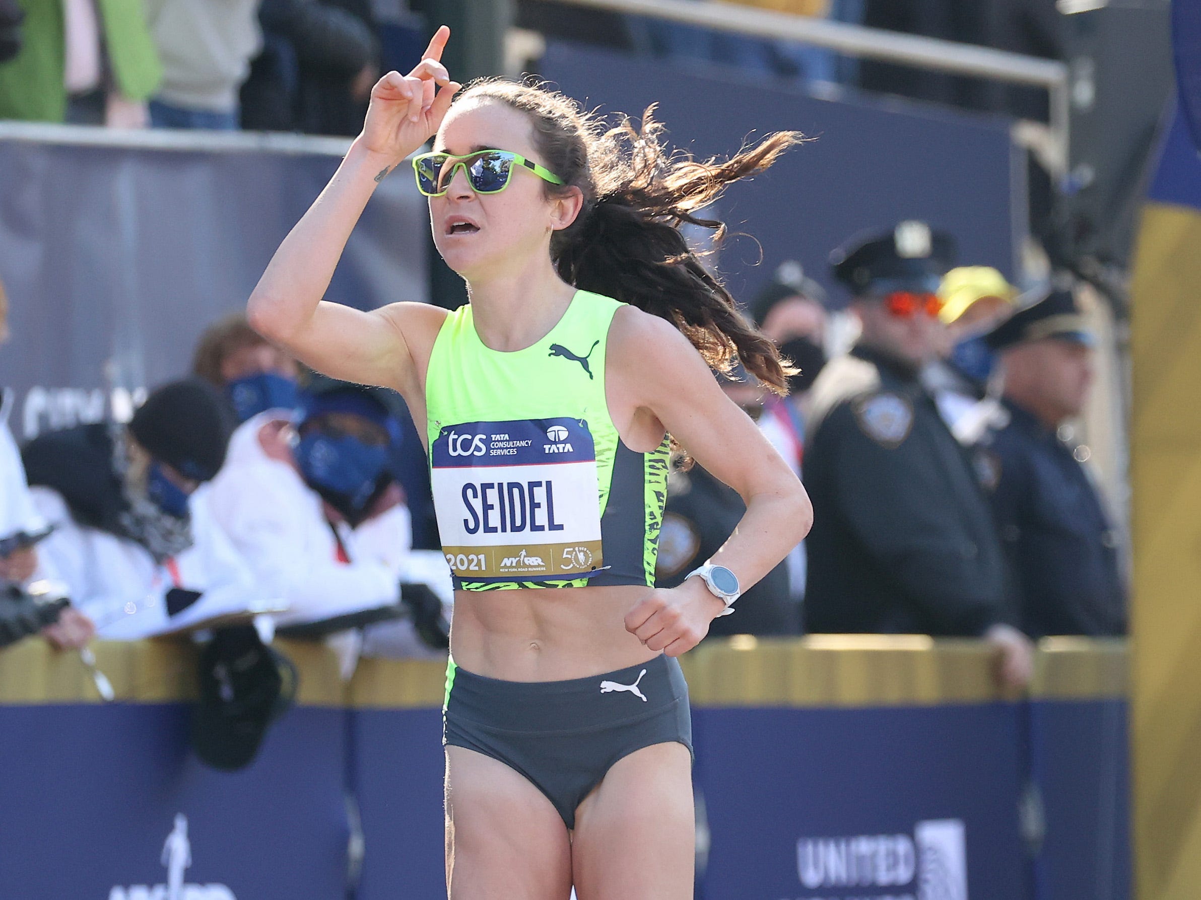 Molly Seidel crosses the finish line at the 2021 NYC Marathon.