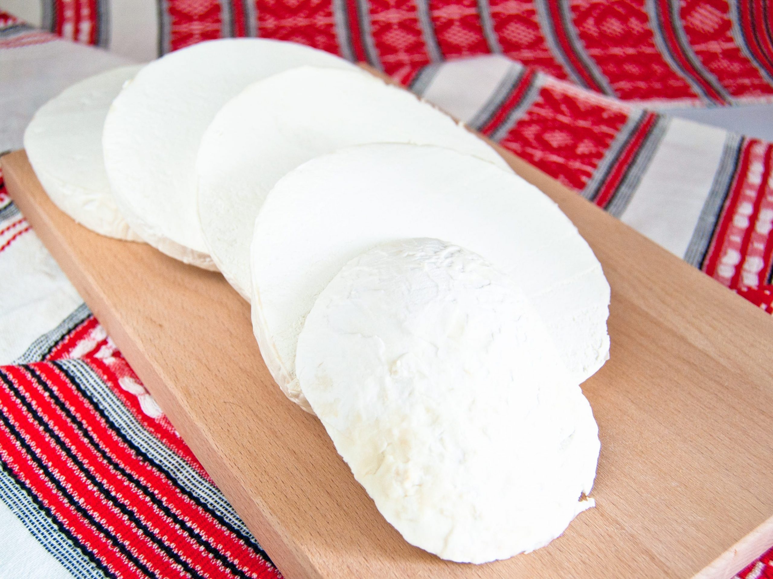 A sliced puffball mushroom on a cutting board.