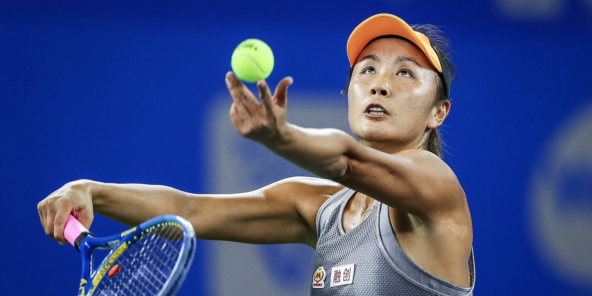 Shuai Peng of China severs during the match against Garbine Muguruza of Spain on Day 2 of 2019 Dongfeng Motor Wuhan Open