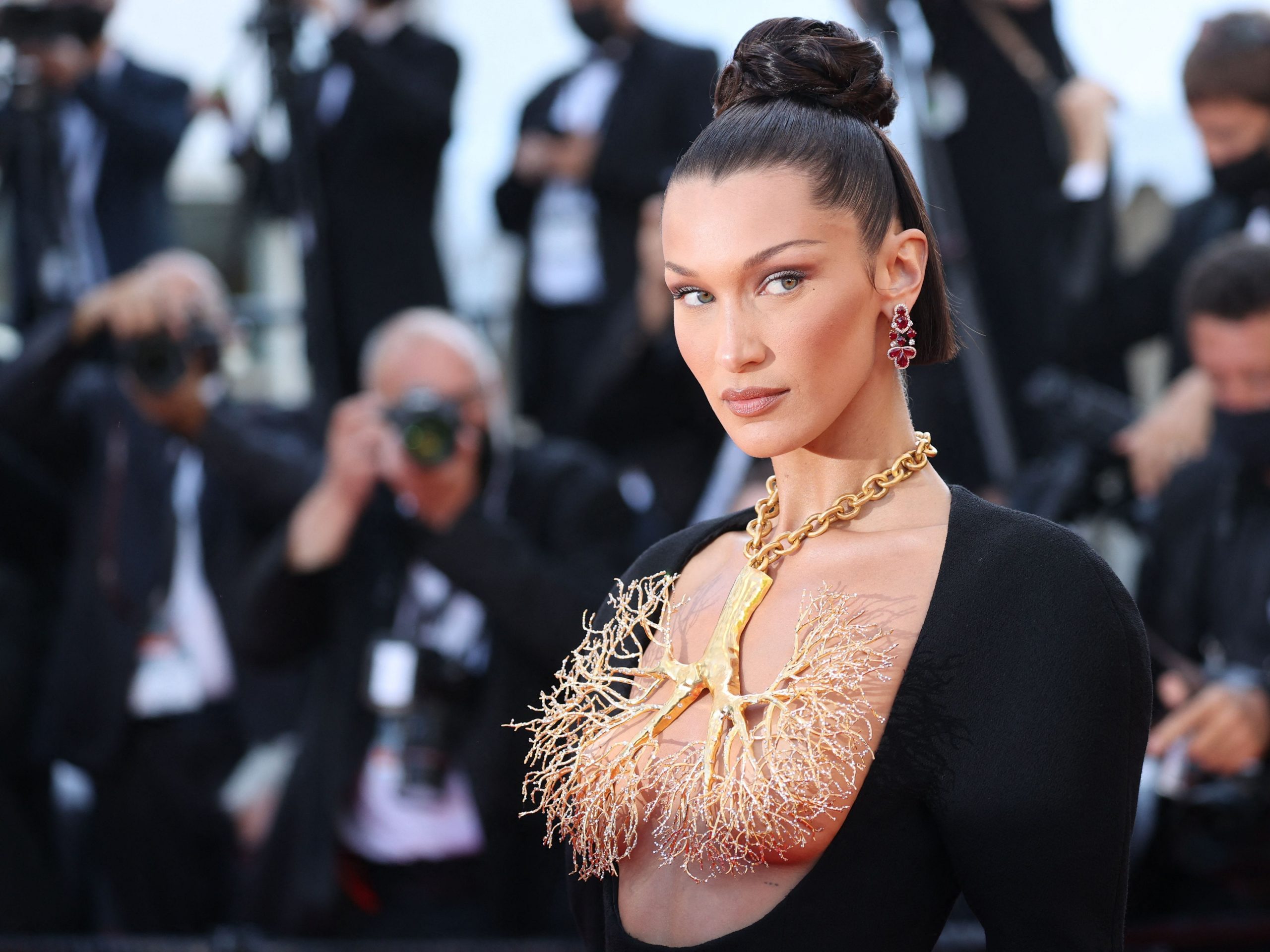 US model Bella Hadid poses as she arrives for the screening of the film "Tre Piani" (Three Floors) at the 74th edition of the Cannes Film Festival in Cannes, southern France, on July 11, 2021