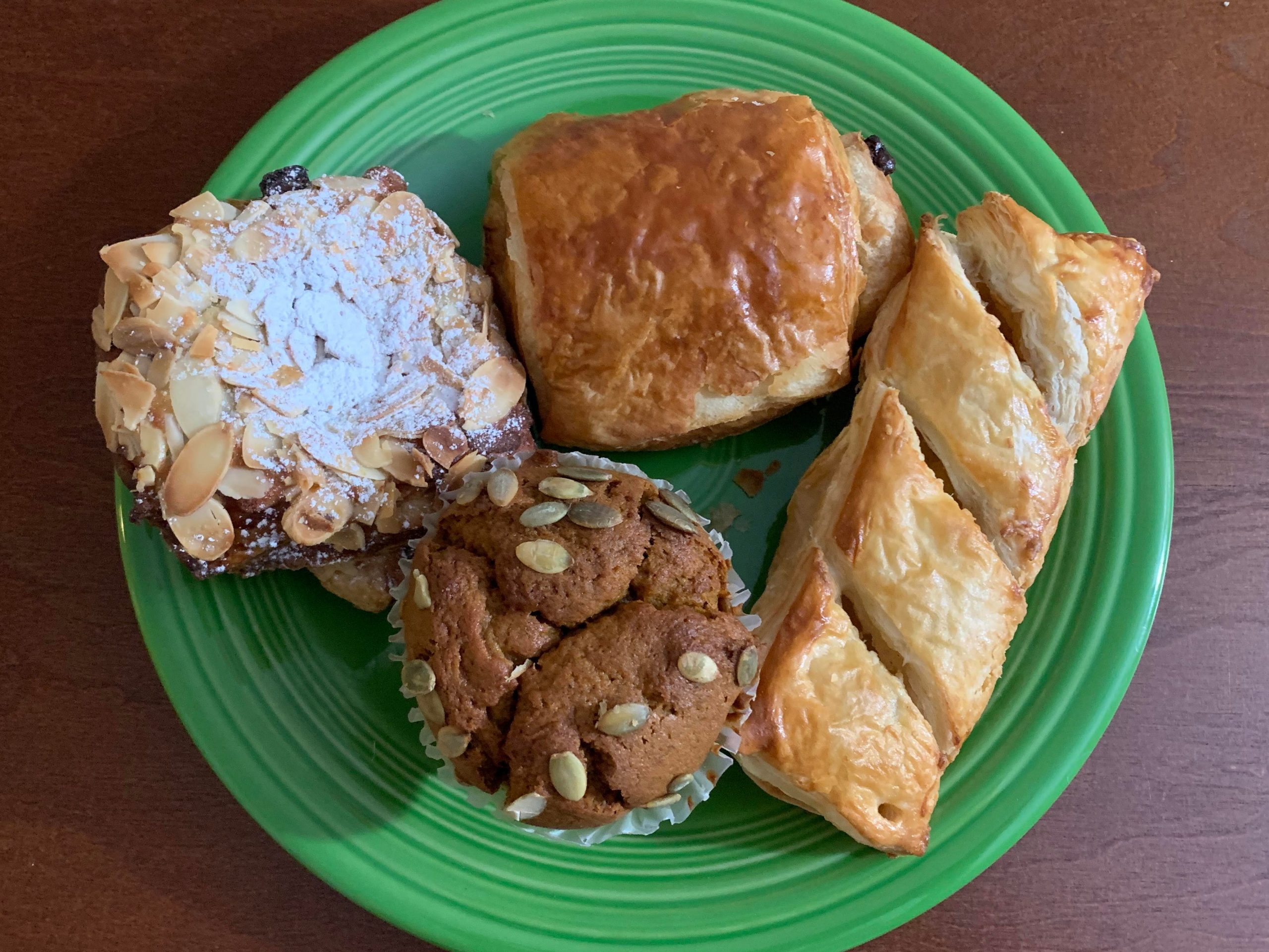 Four pastries on a green plate