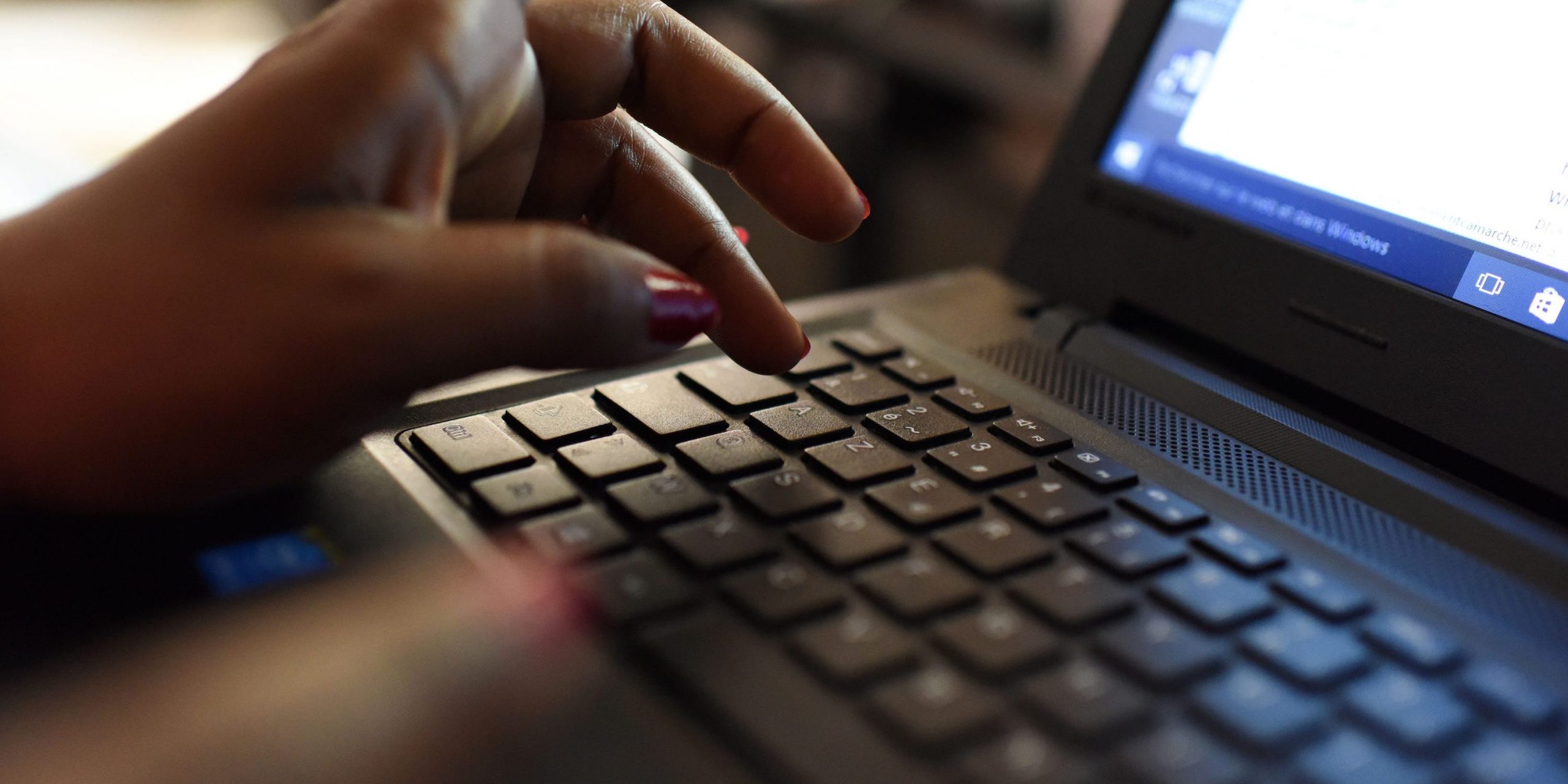 woman uses laptop