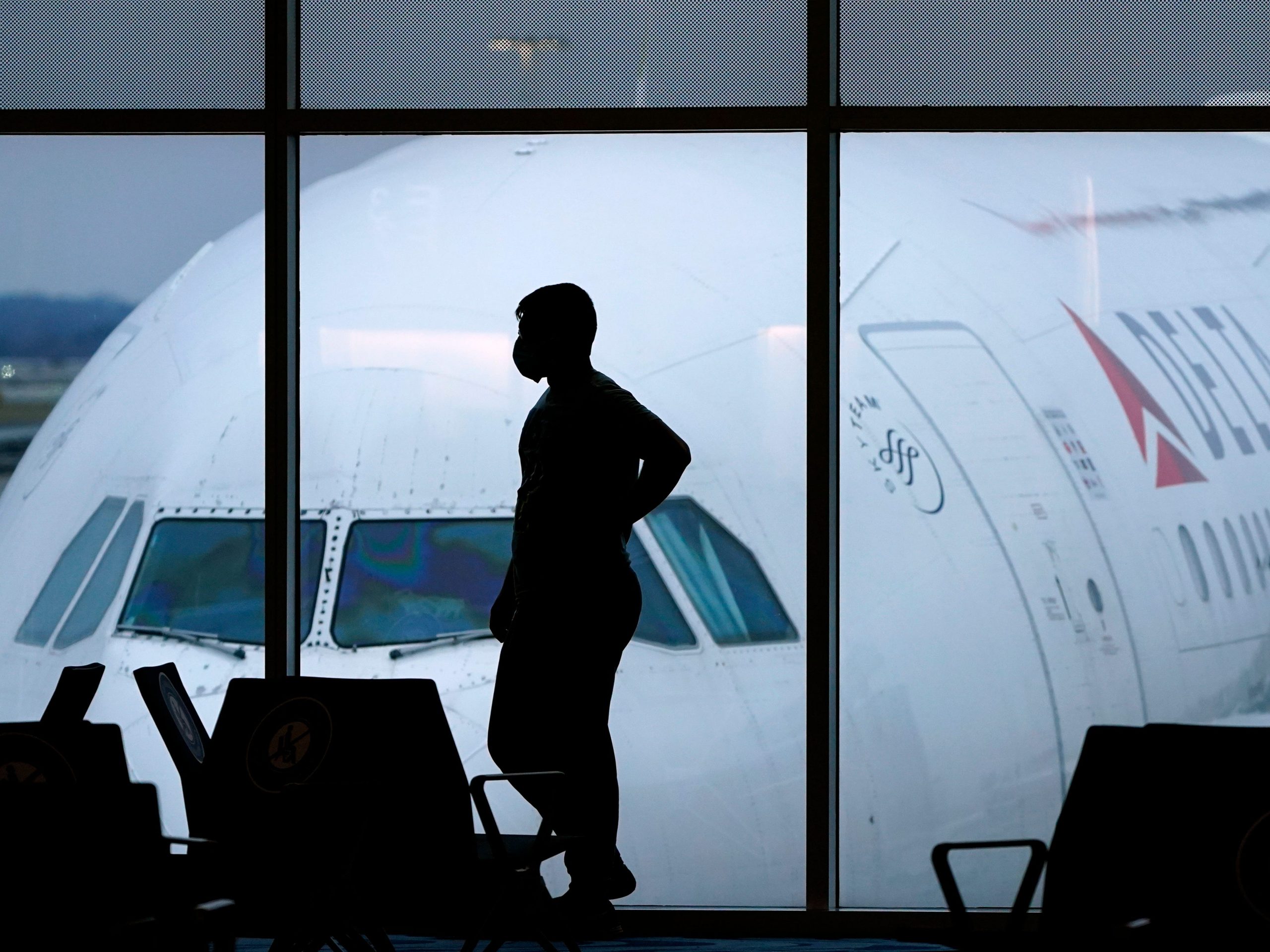 A passenger waits for a flight at Hartsfield-Jackson International Airport in Atlanta.