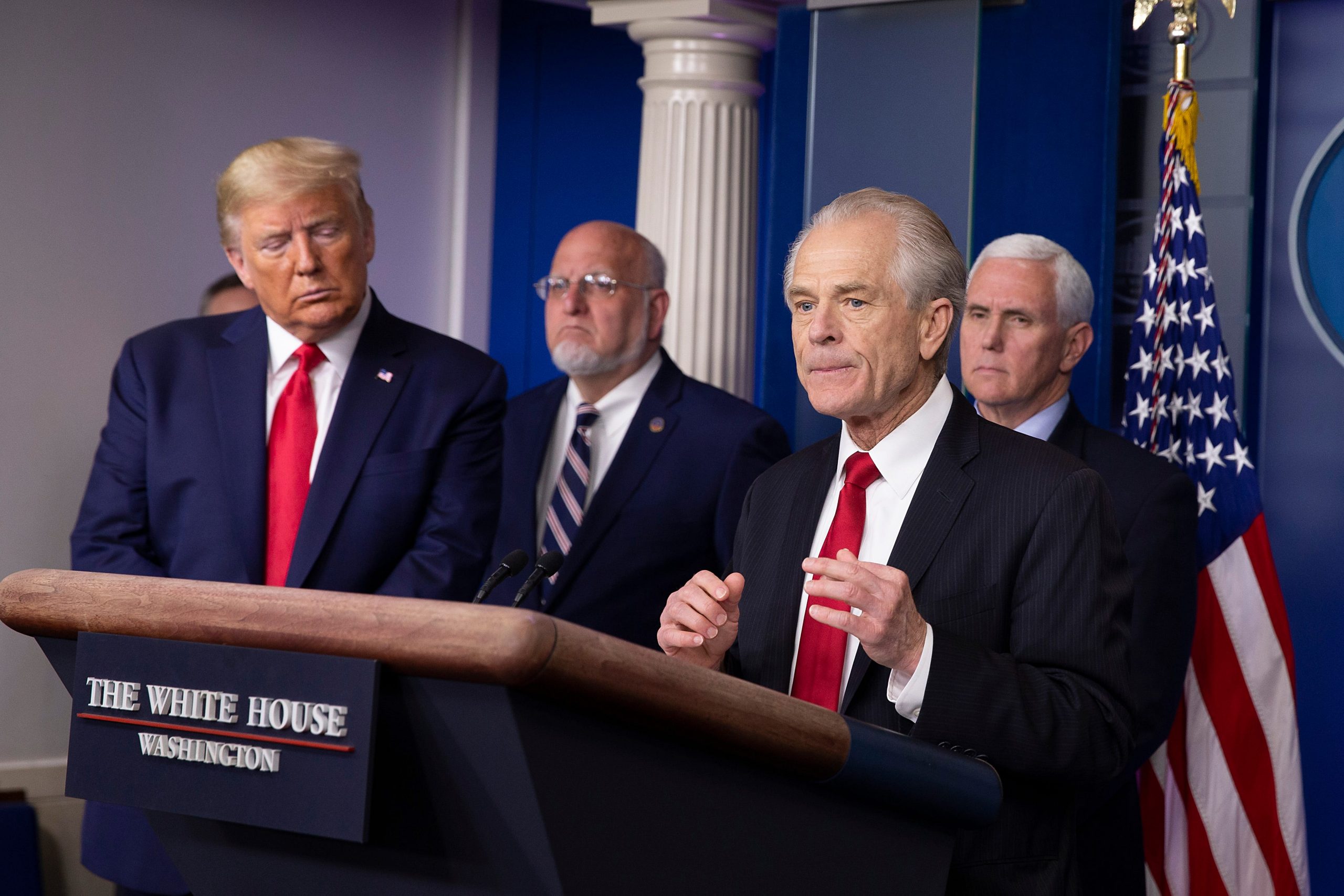 Former President Donald Trump listens to Peter Navarro, Director of the National Trade Council speak during a press briefing on March 22, 2020 in Washington, DC.