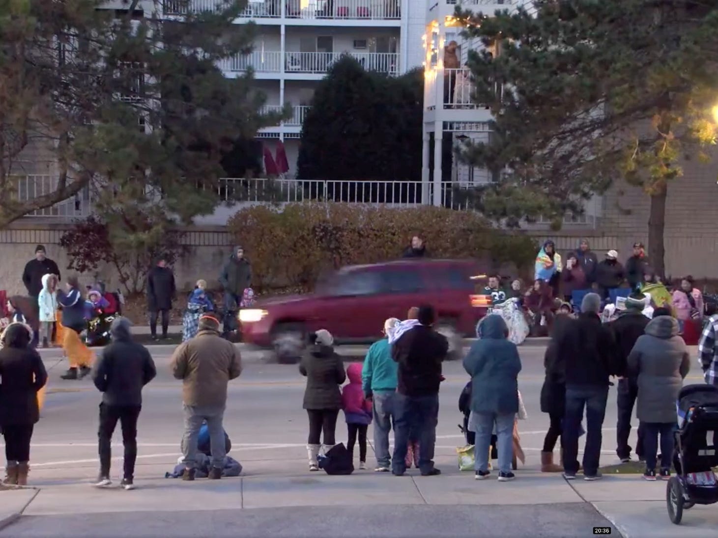 A red SUV speeds past attendees moments before plowing into a crowd at a Christmas parade in Waukesha, Wisconsin, US, in this still image taken from a November 21, 2021 social media video.