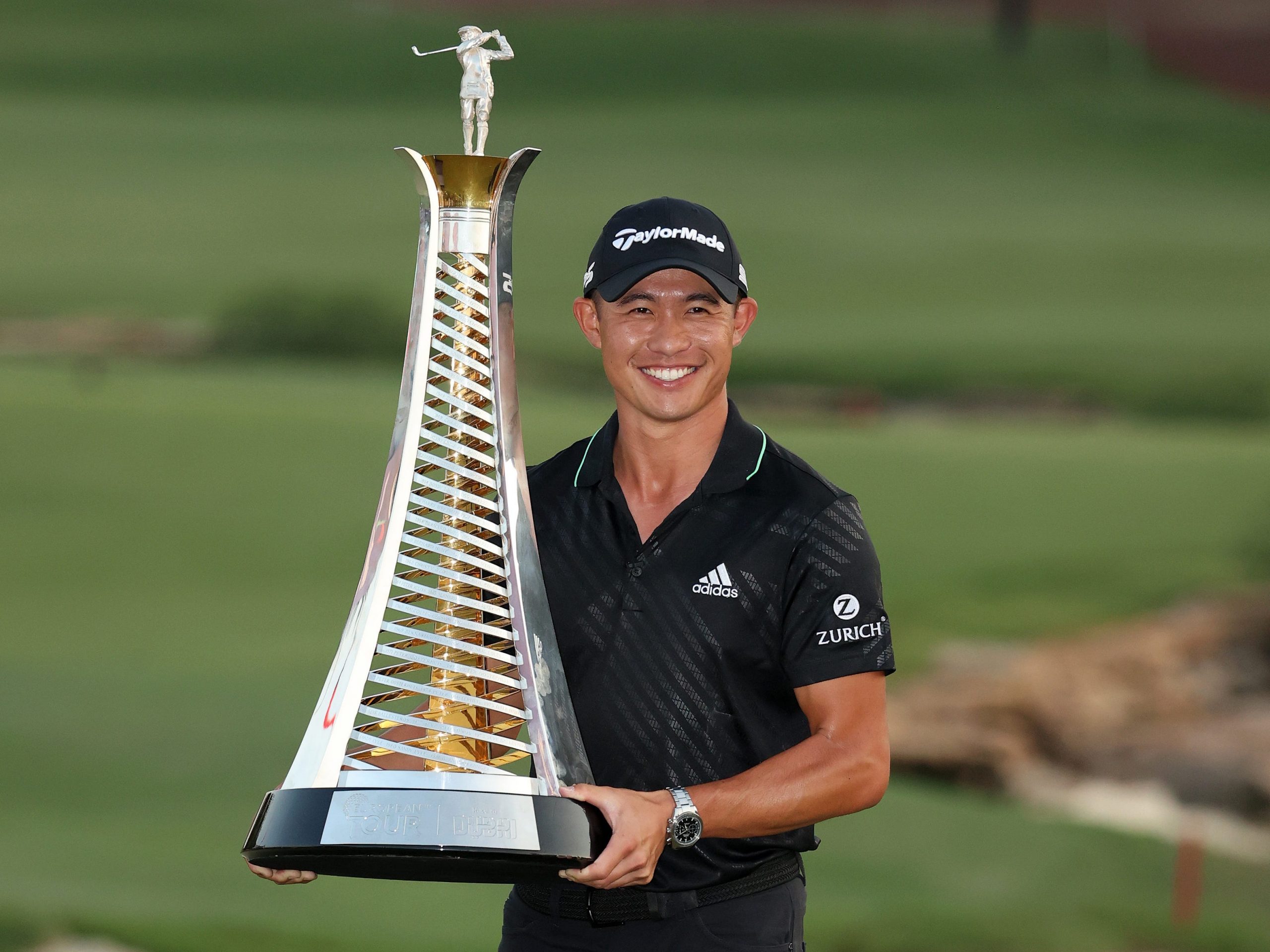 Collin Morikawa with the DP World Tour Championship trophy.