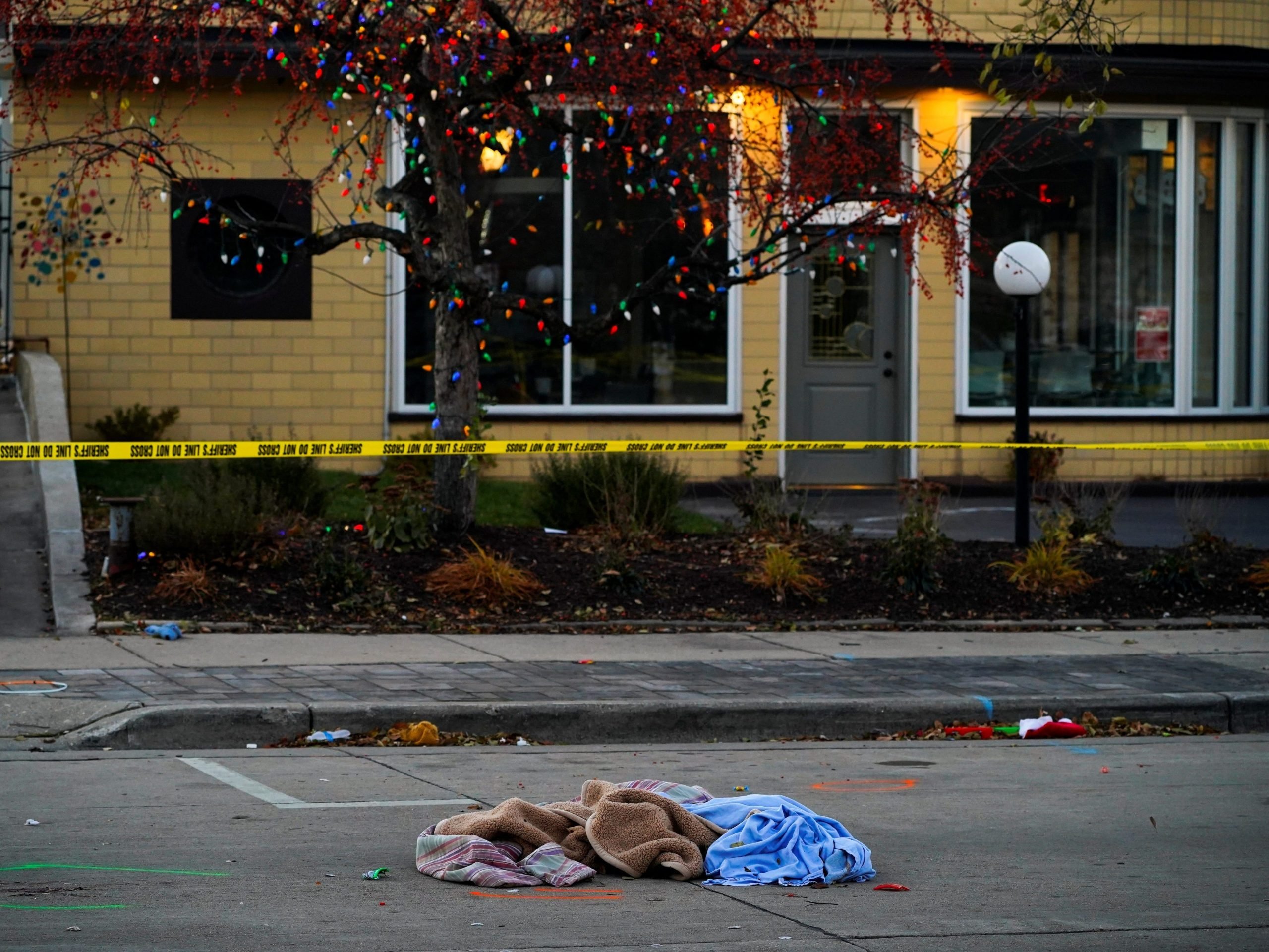 Clothing in the street in the aftermath of Waukesha SUV crash.