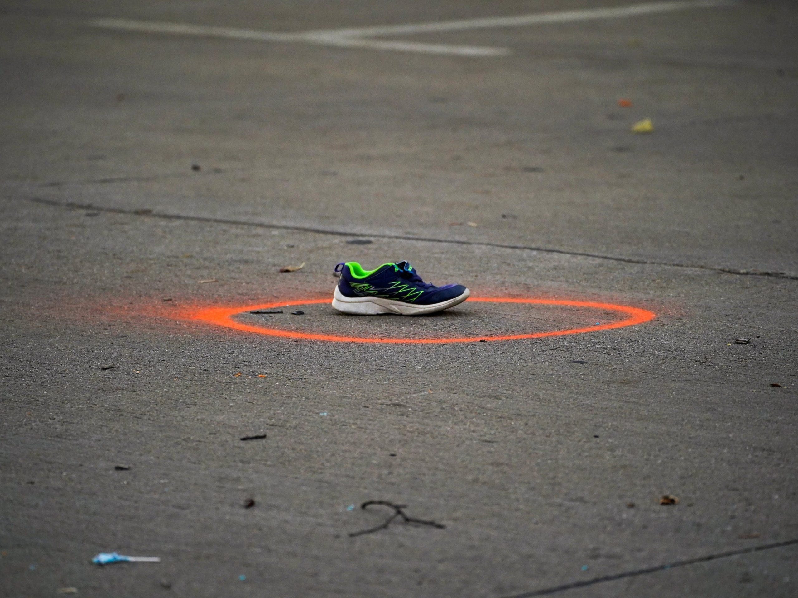 Shoes left at the scene where an SUV crashed into a crowd in Waukesha, Wisconsin.