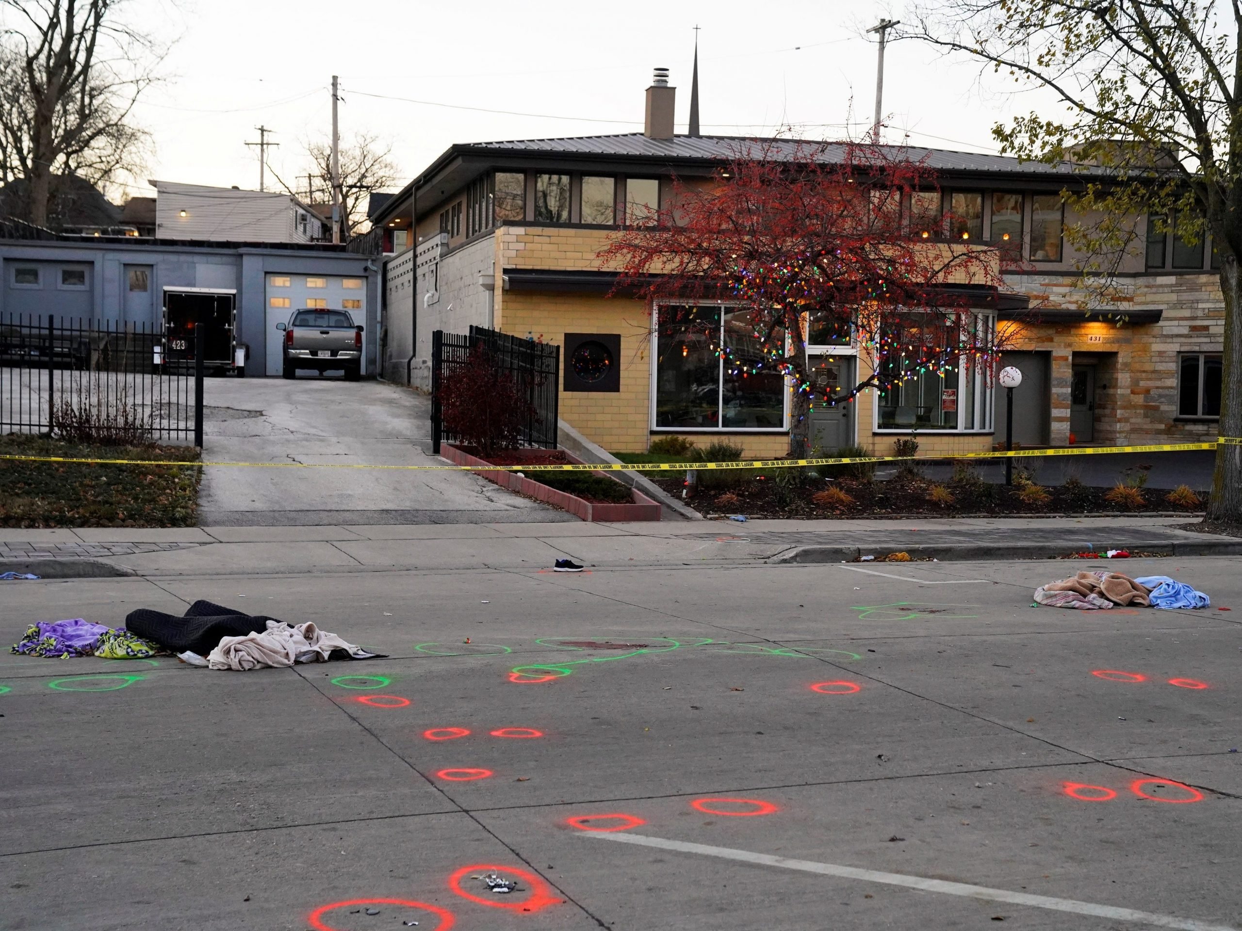 Clothes and shoes scattered at the scene where an SUV drove into a crowd in Waukesha, Wisconsin.