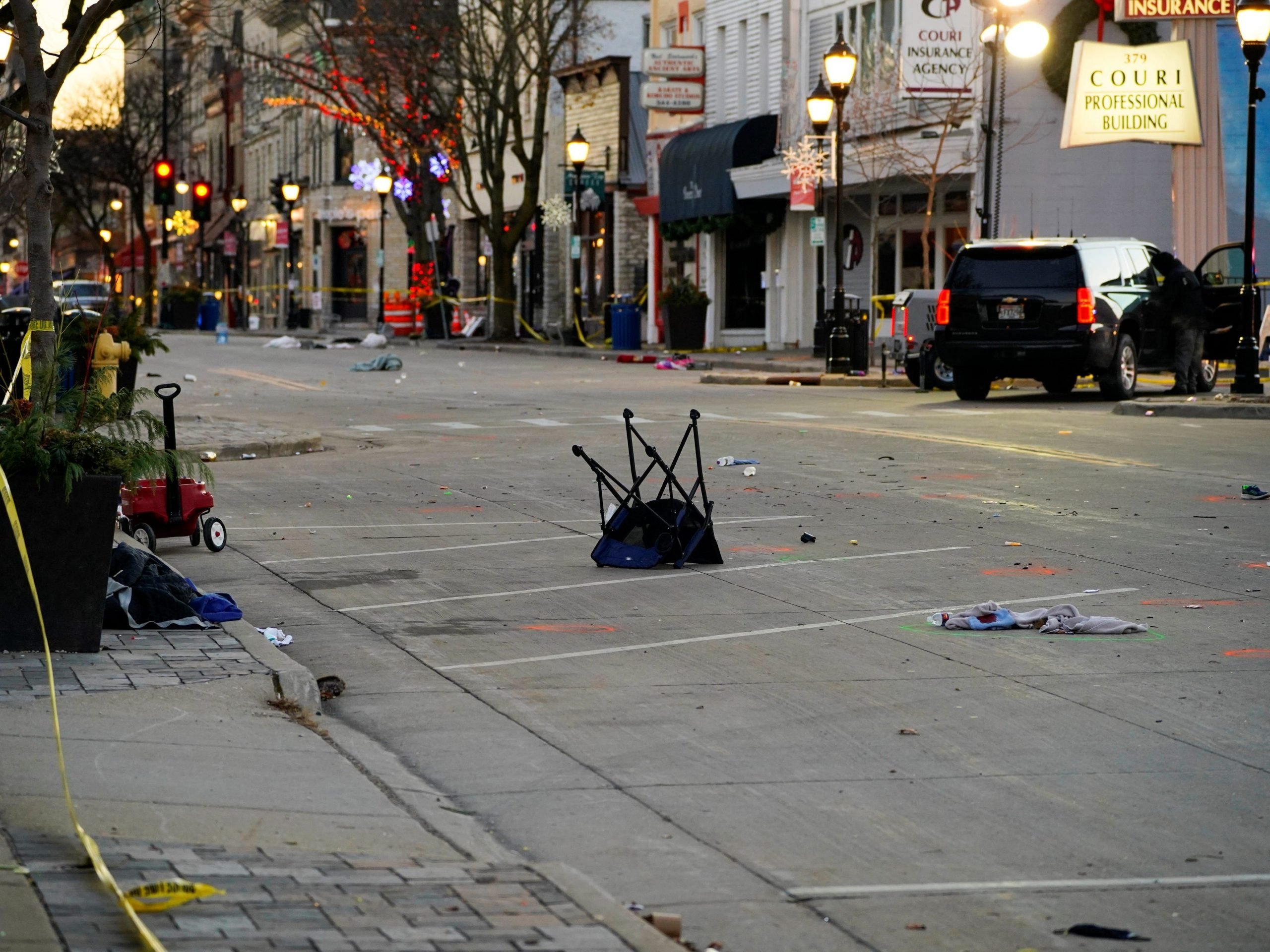 Abandoned clothing, chairs, and shoes litter the streets in Waukesha.