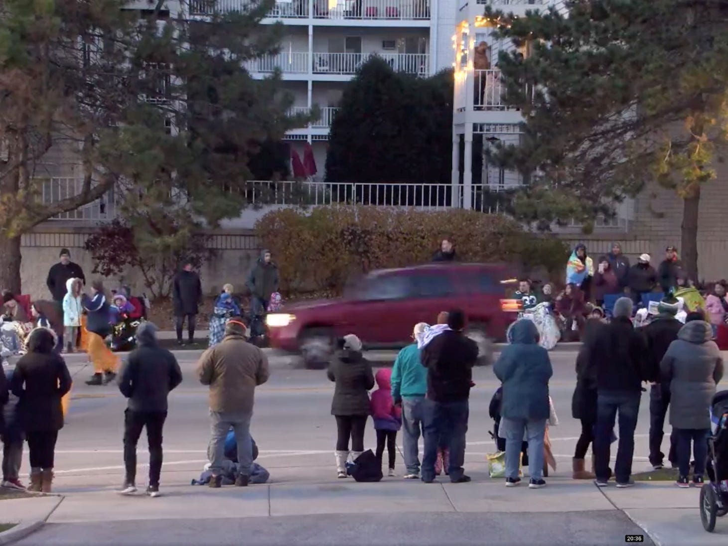 A red SUV speeds past attendees moments before plowing into a crowd at a Christmas parade in Waukesha, Wisconsin, US, in this still image taken from a November 21, 2021 social media video.