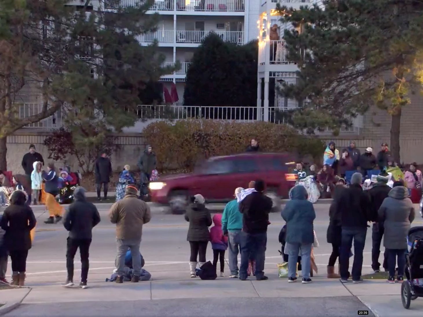 A red SUV speeds past attendees moments before plowing into a crowd at a Christmas parade in Waukesha, Wisconsin, US, in this still image taken from a November 21, 2021 social media video.