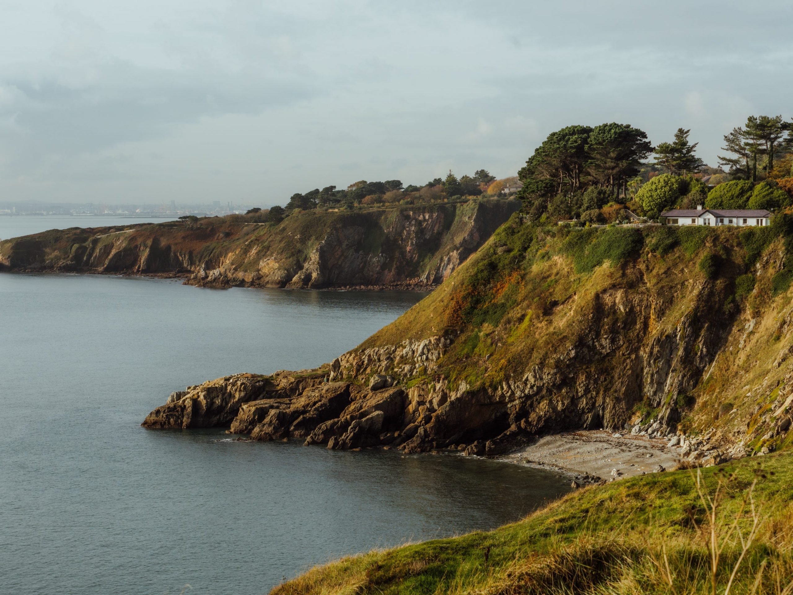 A view of the coastline along the Howth Cliff Path trail in Dublin, Ireland.