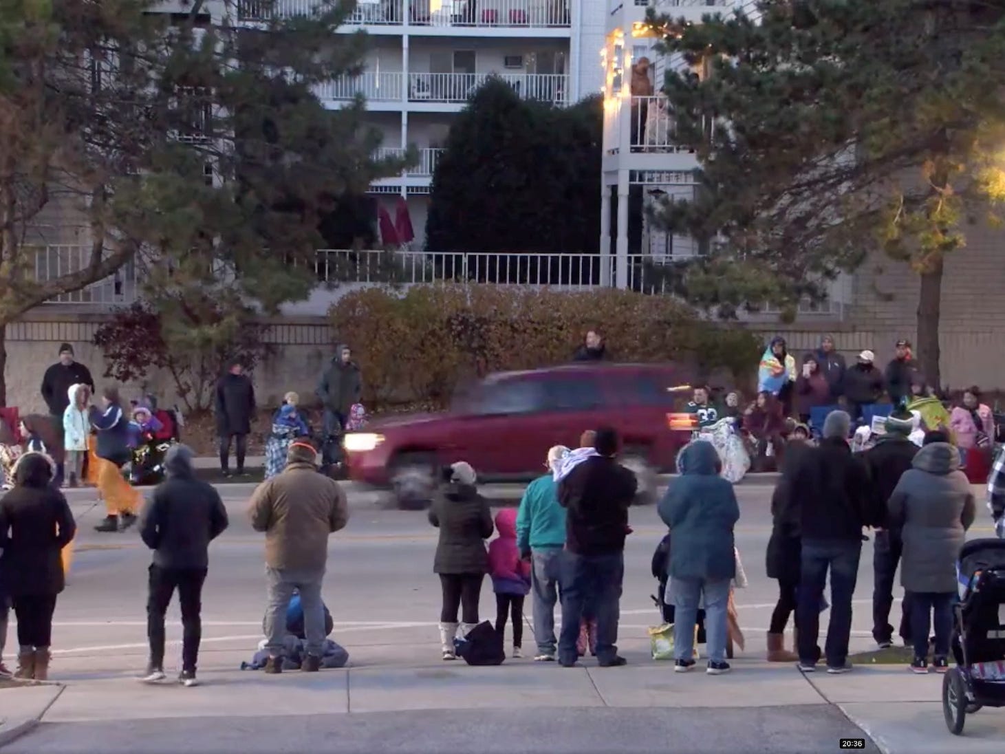 A red SUV speeds past attendees moments before plowing into a crowd at a Christmas parade in Waukesha, Wisconsin, US, in this still image taken from a November 21, 2021 social media video.