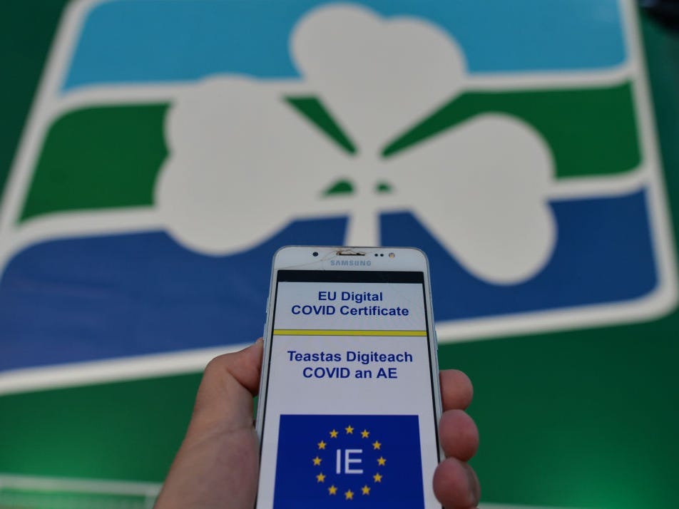 EU Digital COVID Certificate displayed on the mobile phone seen in front of an Irish Ferry.