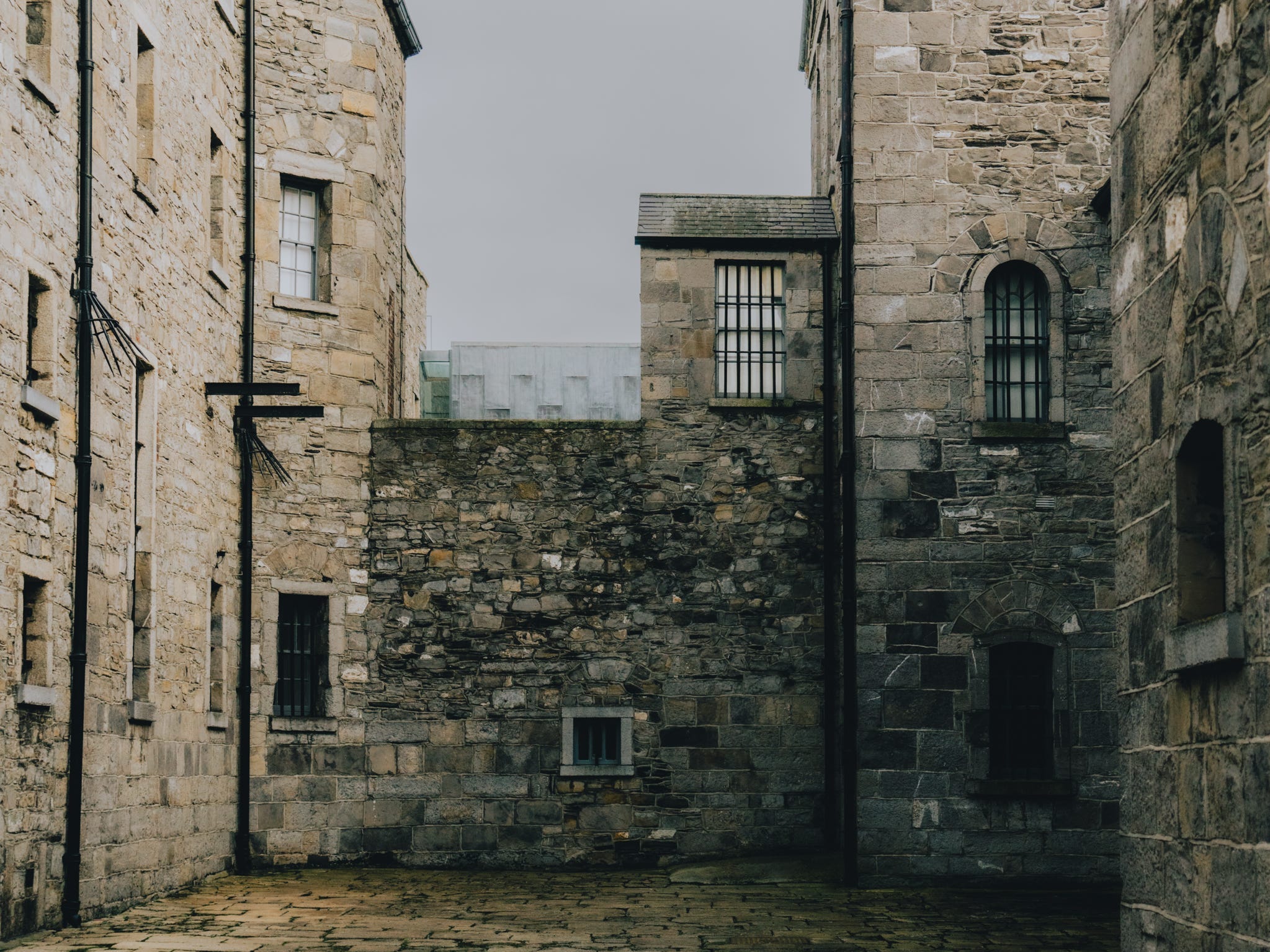 Old stone walls at Kilmainham Gaol, a former prision turned museum in Dublin.