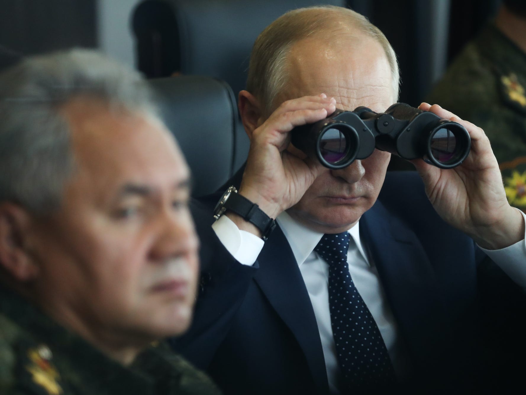 Putin observes the Zapad 2021 military exercises through binoculars.