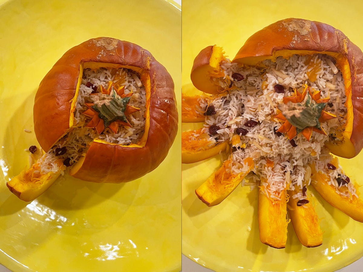 A baked pumpkin sliced into wedges with rice.