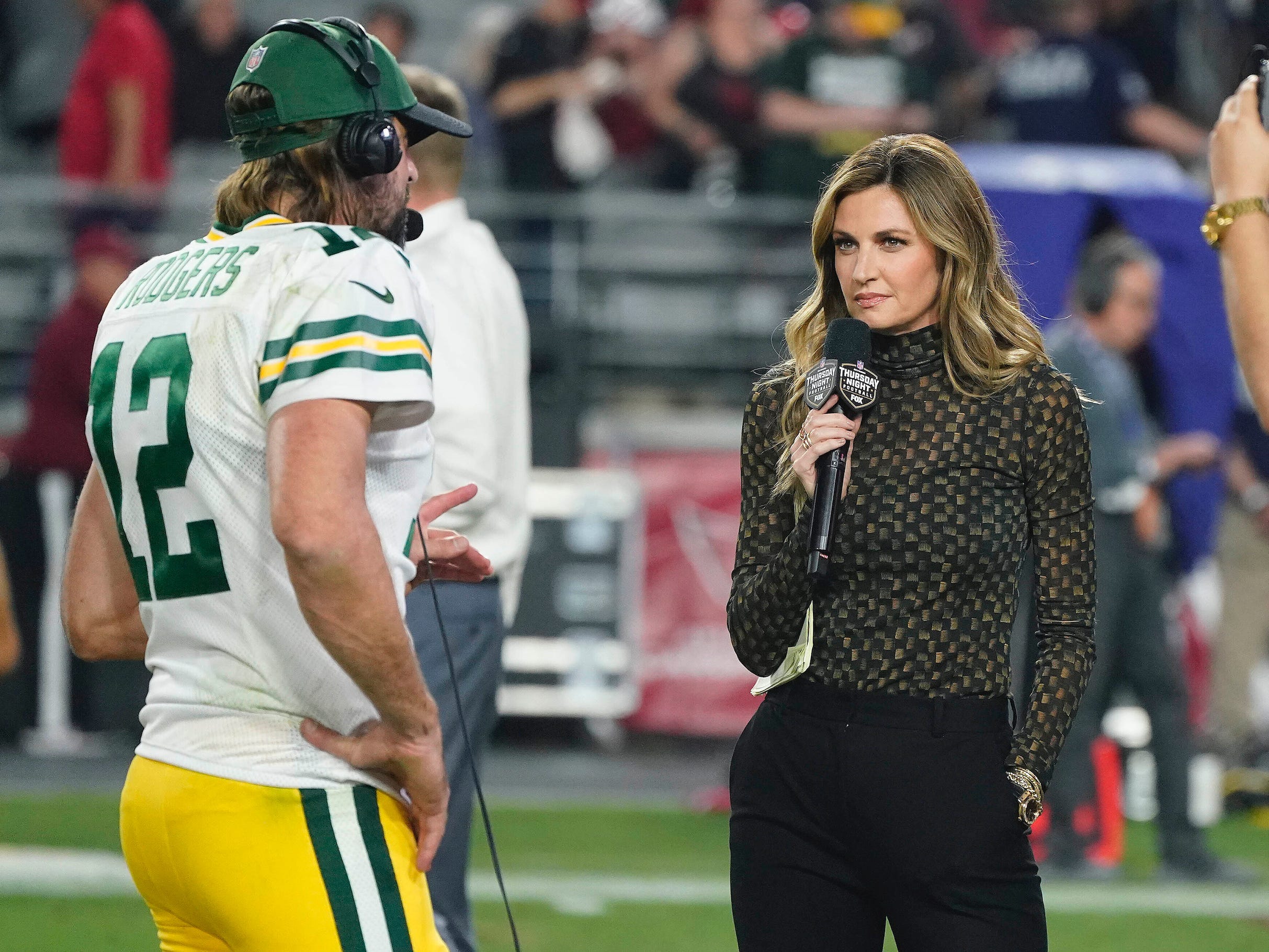 Erin Andrews (right) interviews Green Bay Packers quarterback Aaron Rodgers.