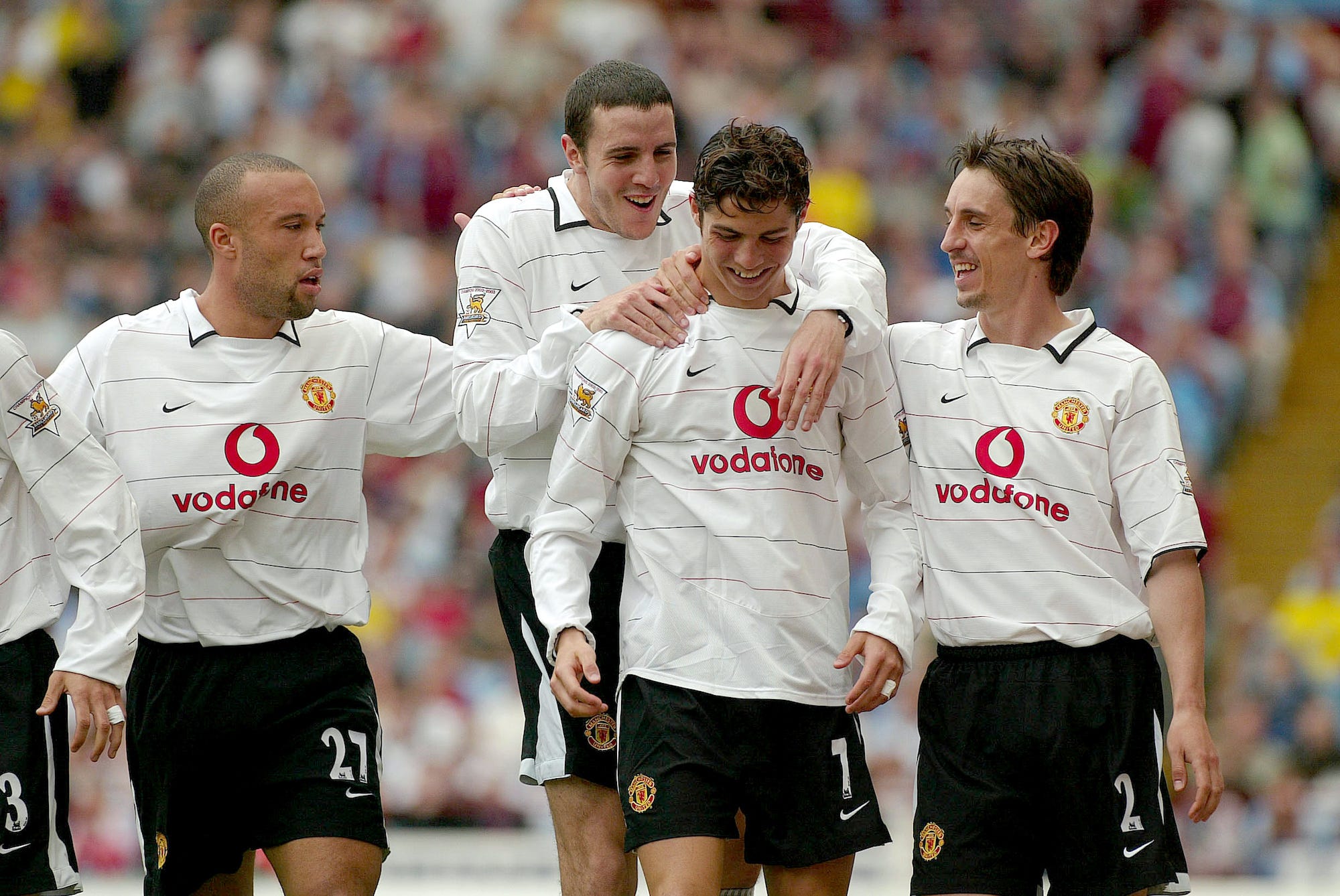 Cristiano Ronaldo of Manchester United celebrates scoring a goal with from left, Mikael Silvestre, John O'Shea and Gary Neville during the game between Aston Villa and Manchester United