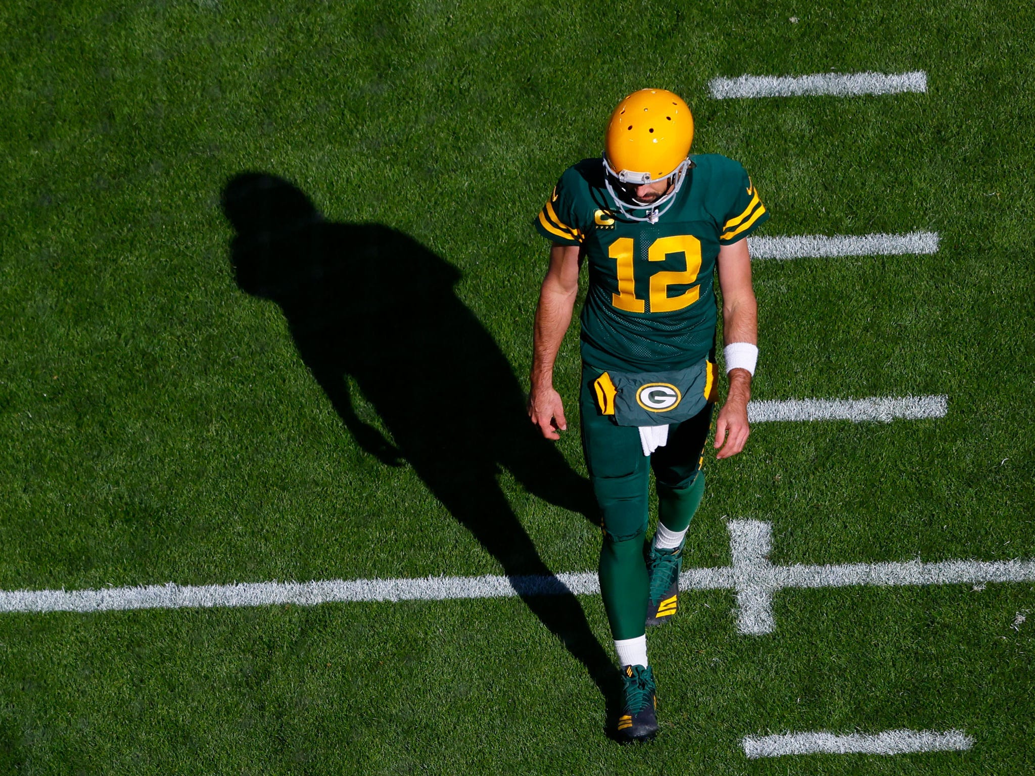 Aaron Rodgers warms up ahead of a game against the Washington Football Team.