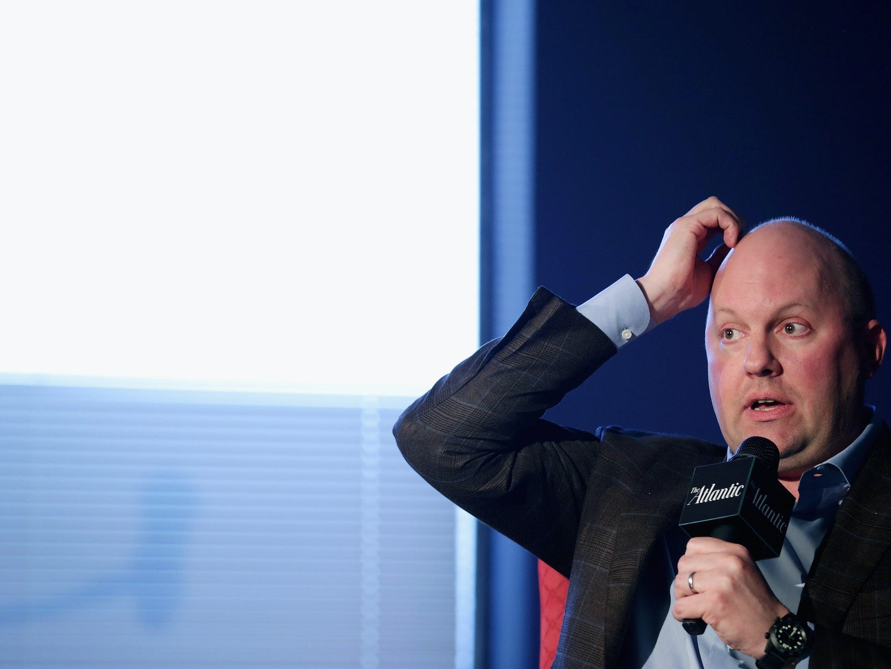 Marc Andreessen scratches his head during a live interview with the Atlantic.