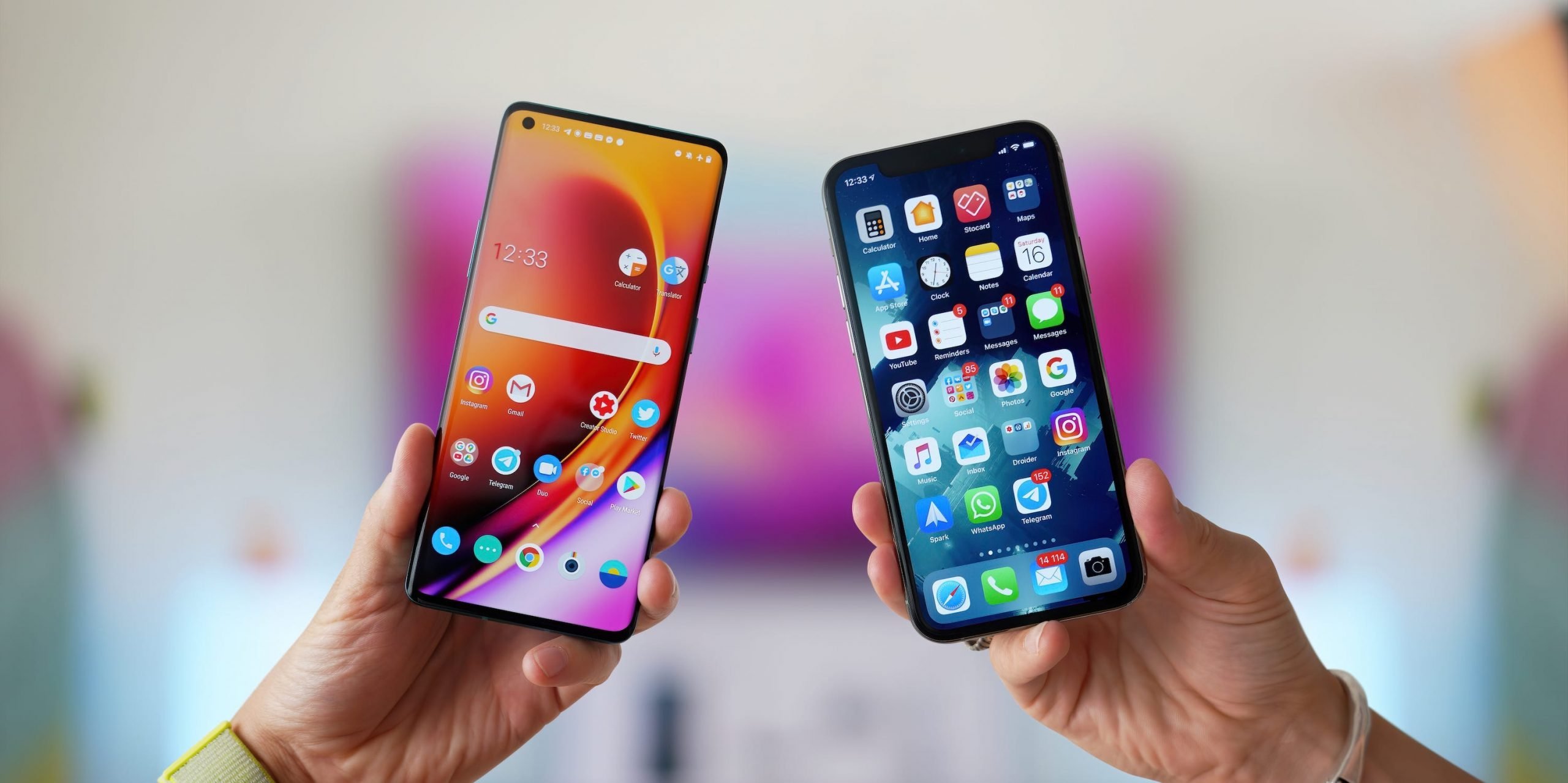 An Android phone and an iPhone, held up next to each other.