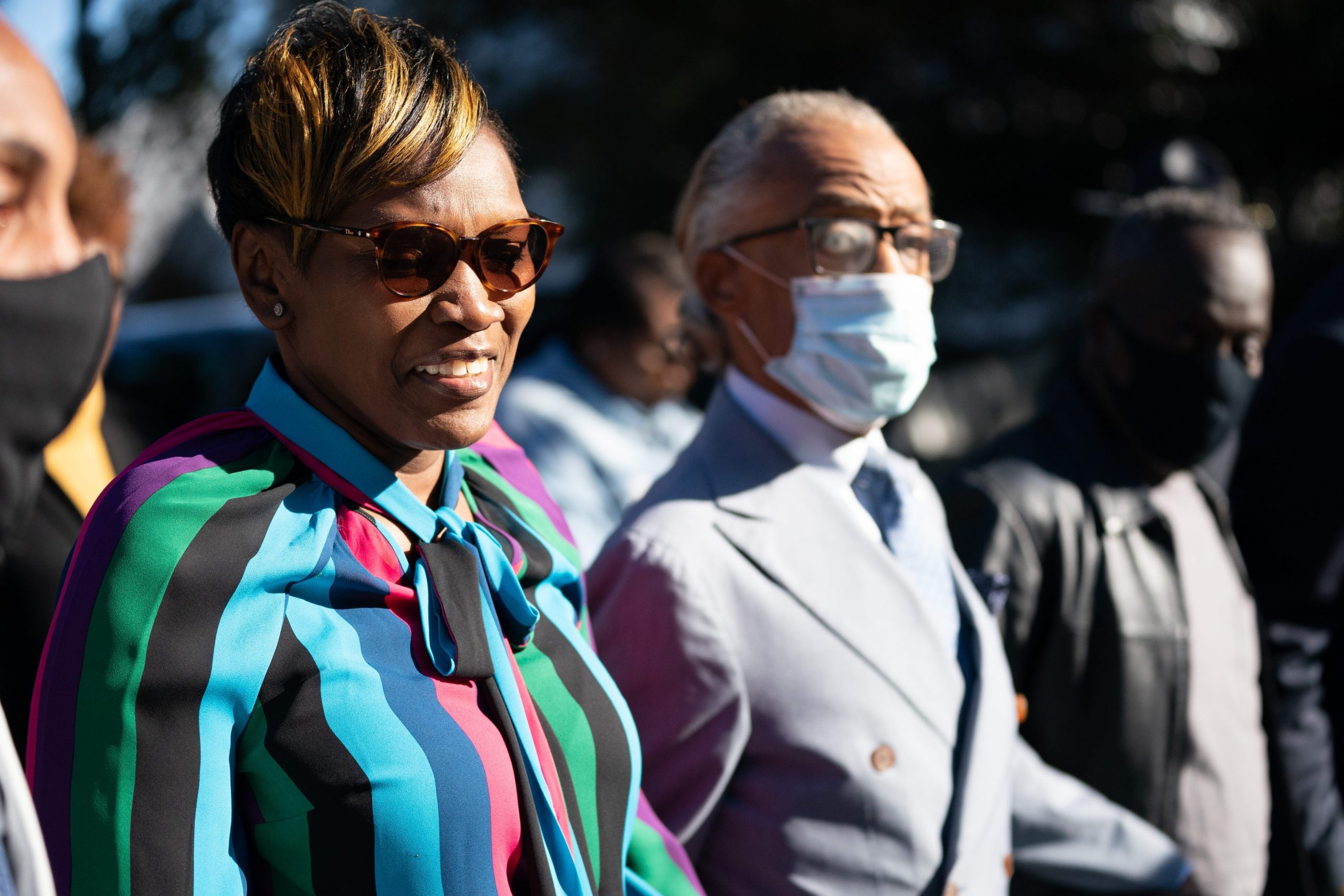 Wanda Cooper-Jones, mother of Ahmaud Arbery, walking with Rev. Al Sharpton