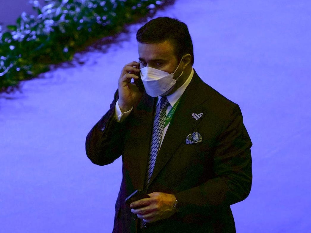 Maj. Gen. Ahmed Naser al-Raisi on a phone call while wearing a mask