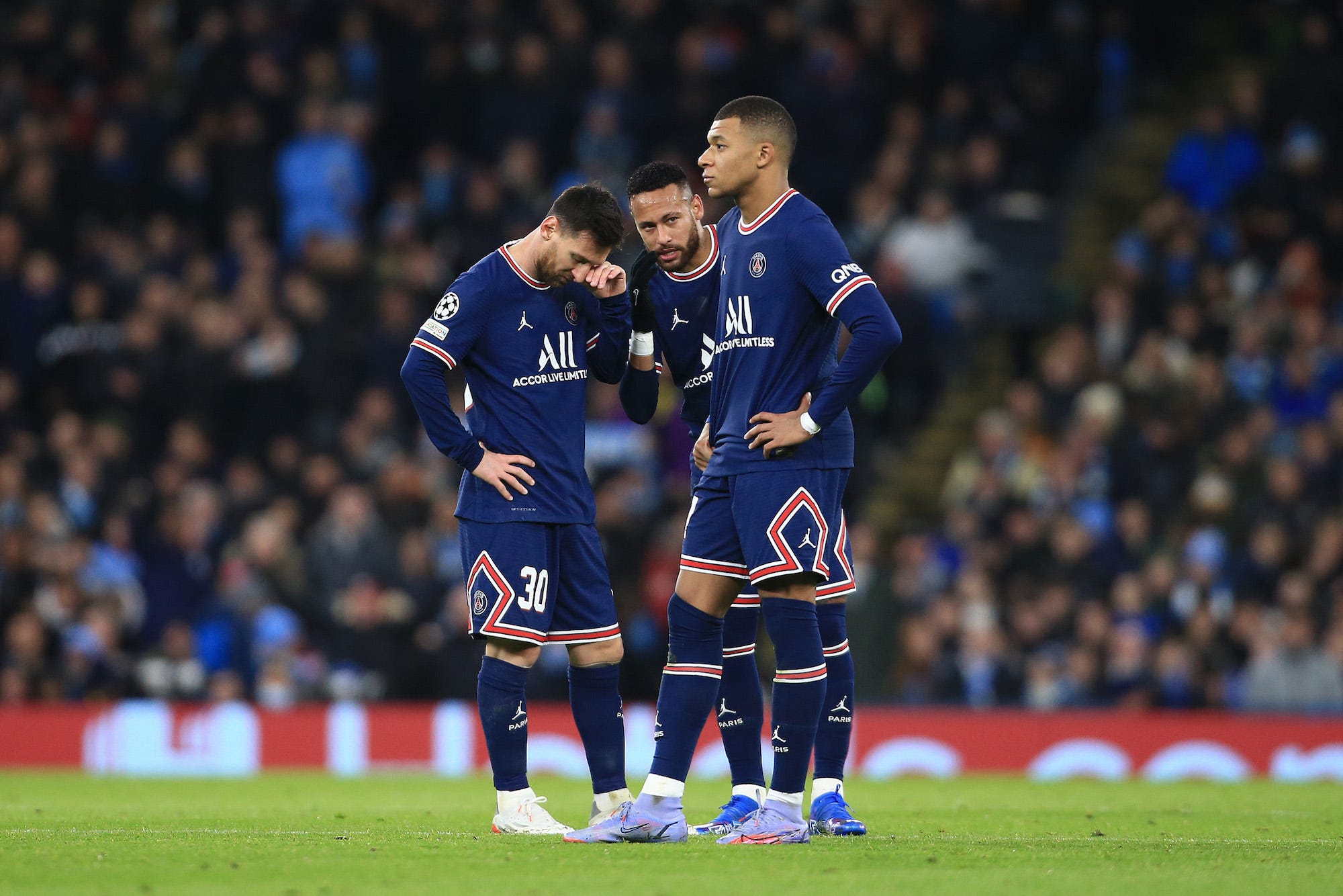 Lionel Messi, Kylian Mbappe and Neymar stand together after the equalising Man City goal during the UEFA Champions League group A match between Manchester City and Paris Saint-Germain at Etihad Stadium
