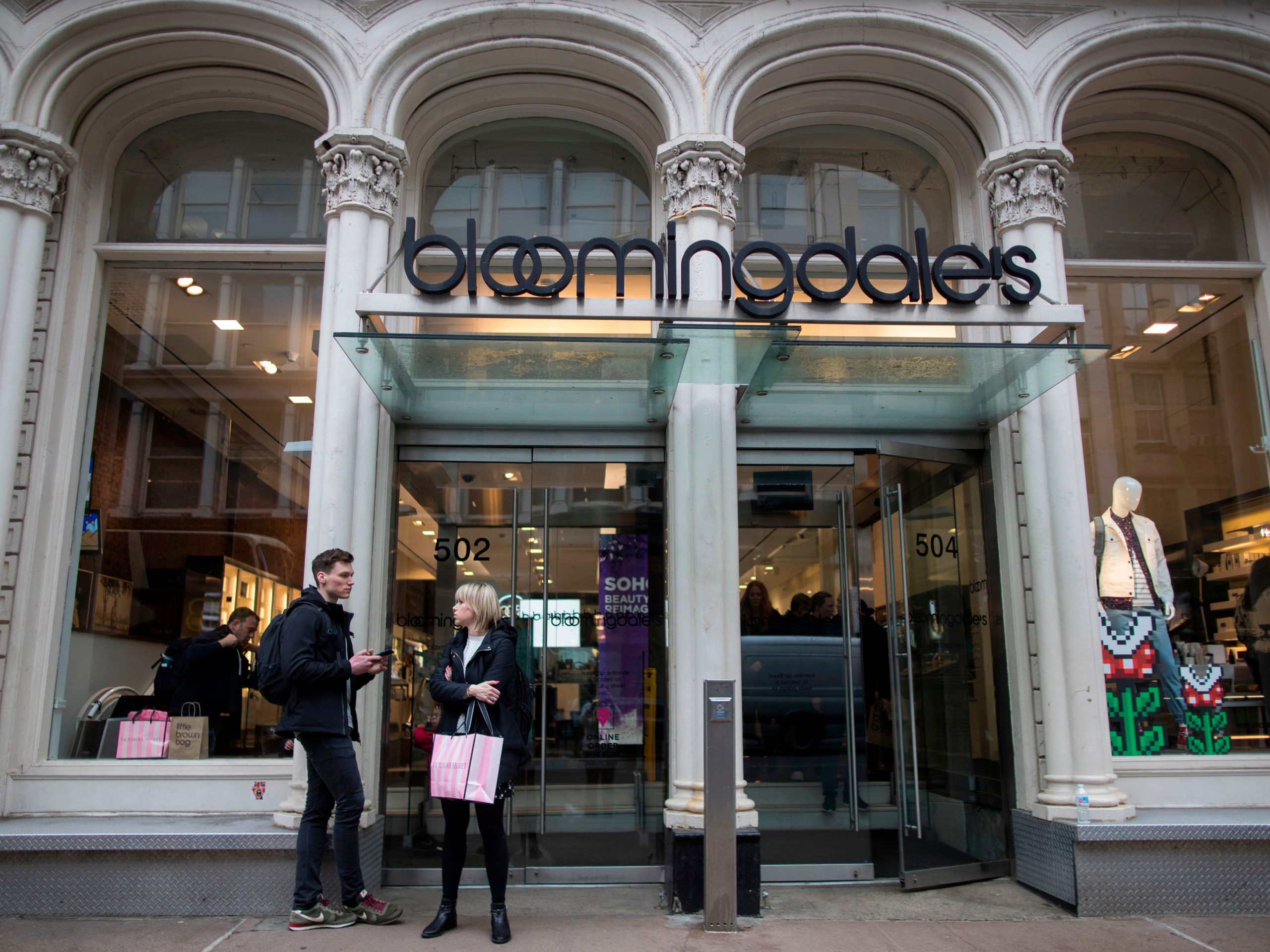 Photo of Bloomingdale's store front with two passersby
