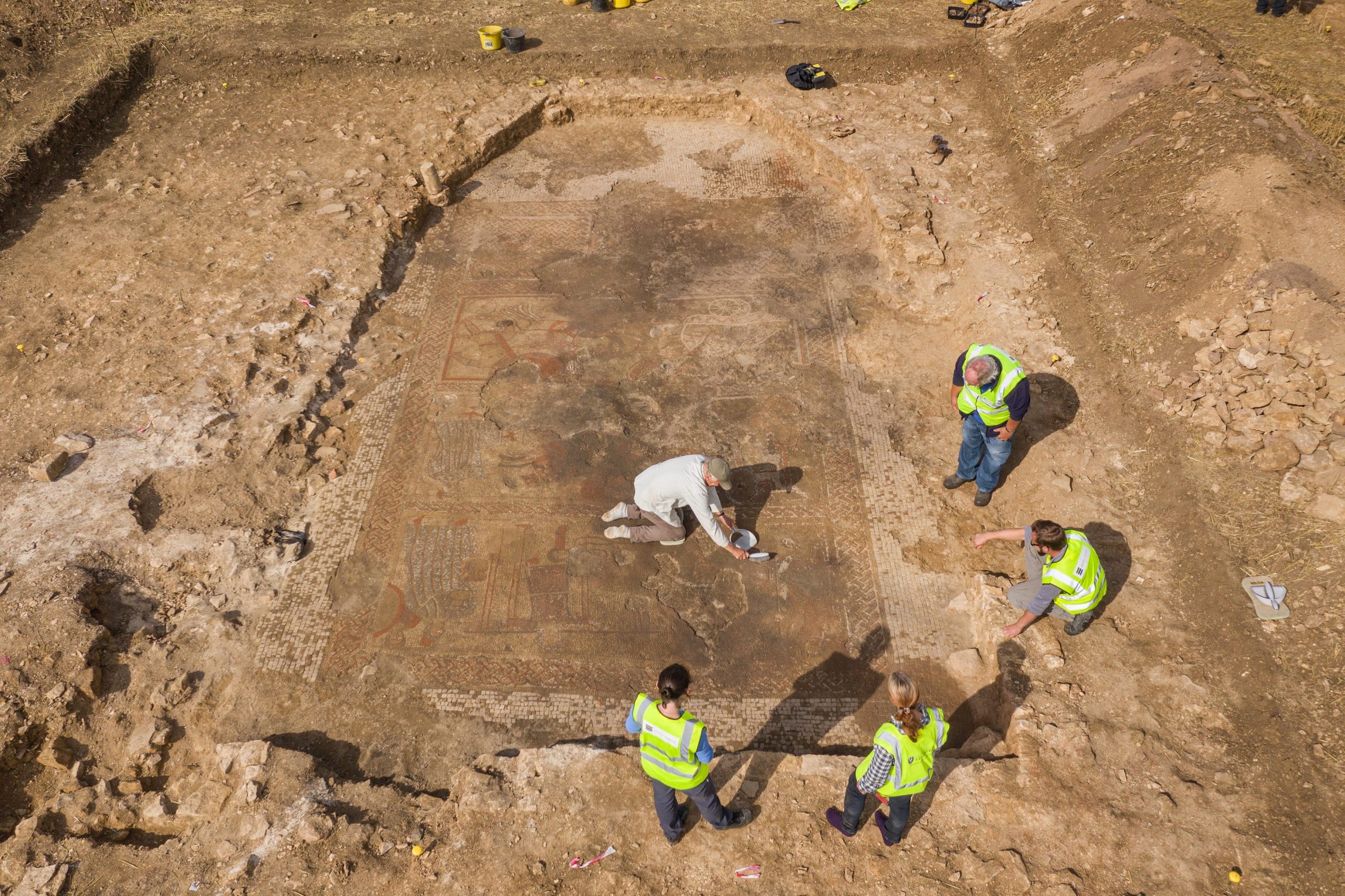 Drone photography, aerial view of the Historic England staff with team members from ULAS/University of Leicester during the excavations of a large Roman mosaic.