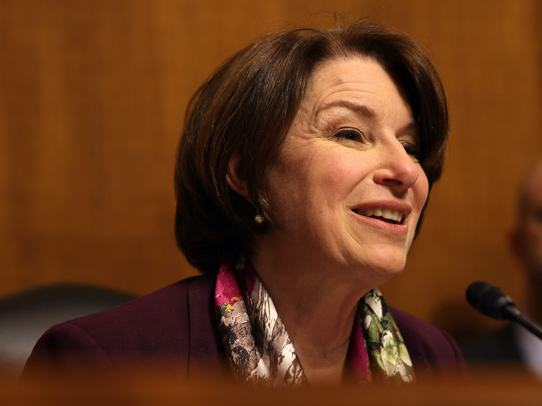 senator Amy Klobuchar smiles during a tech hearing