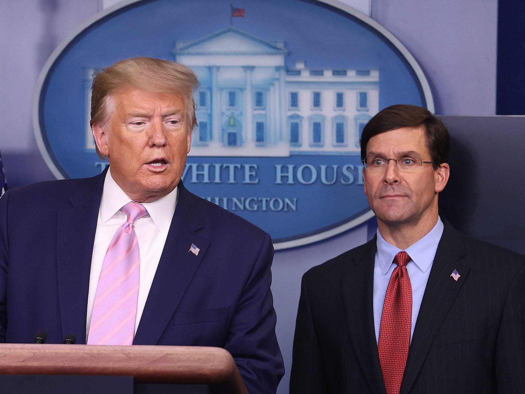 Former President Donald Trump speaks at the press briefing room as former Defense Secretary Mark Esper looks on at the White House on April 1, 2020.