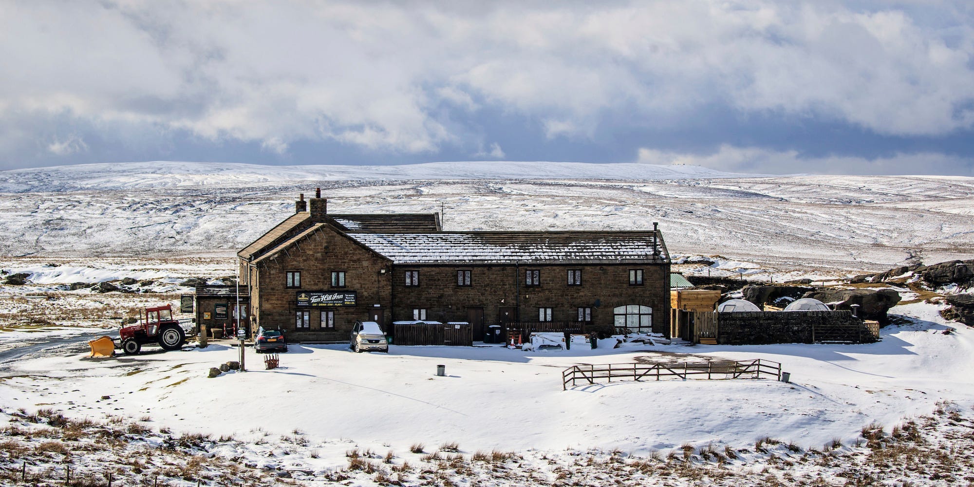 The Tan Hill Inn surrounded by snowy fields