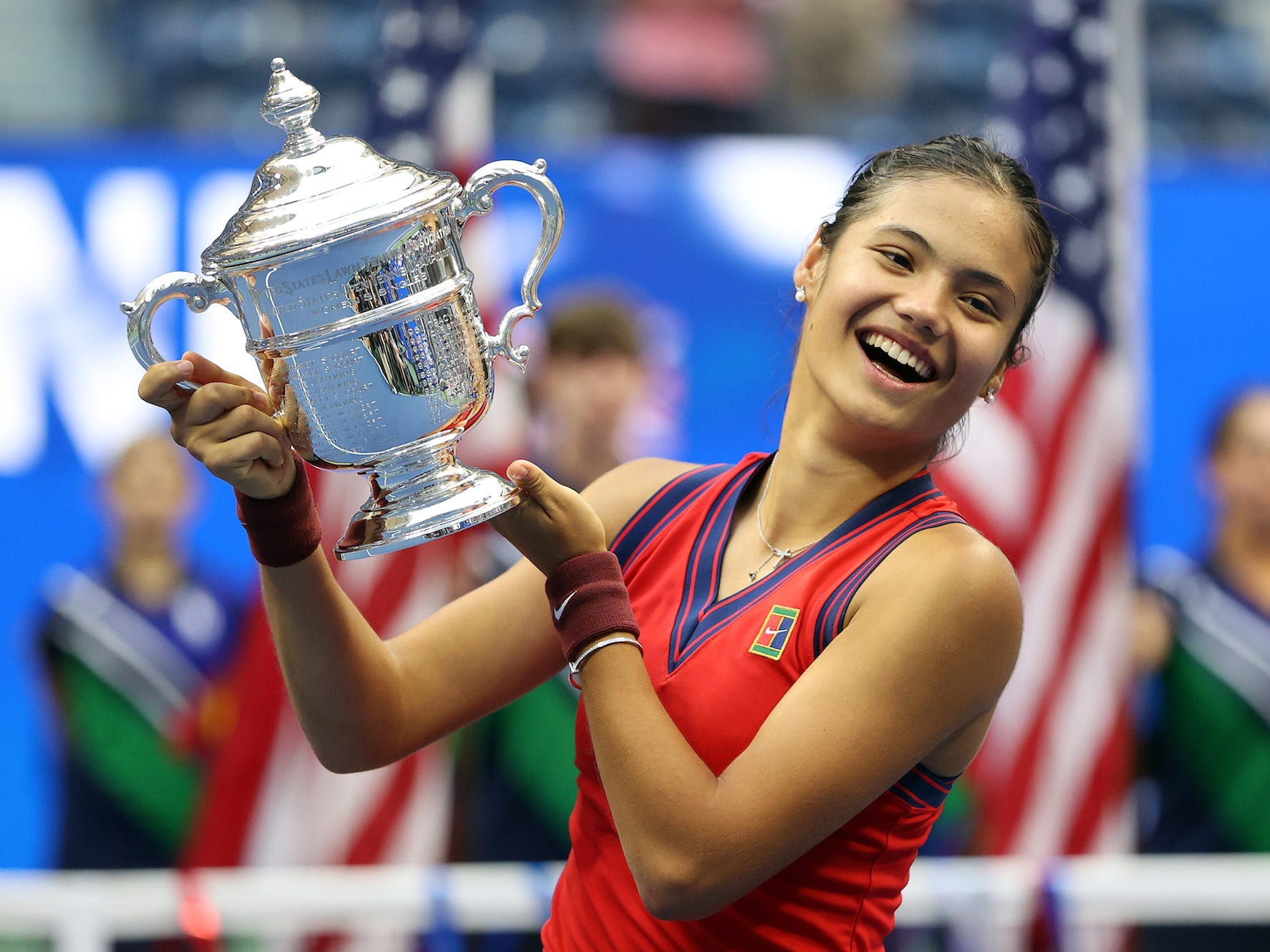 Emma Raducanu of Great Britain celebrates with the championship trophy after defeating Leylah Annie Fernandez of Canada during their Women's Singles final match on Day Thirteen of the 2021 US Open at the USTA Billie Jean King National Tennis Center on September 11, 2021 in the Flushing neighborhood of the Queens borough of New York City