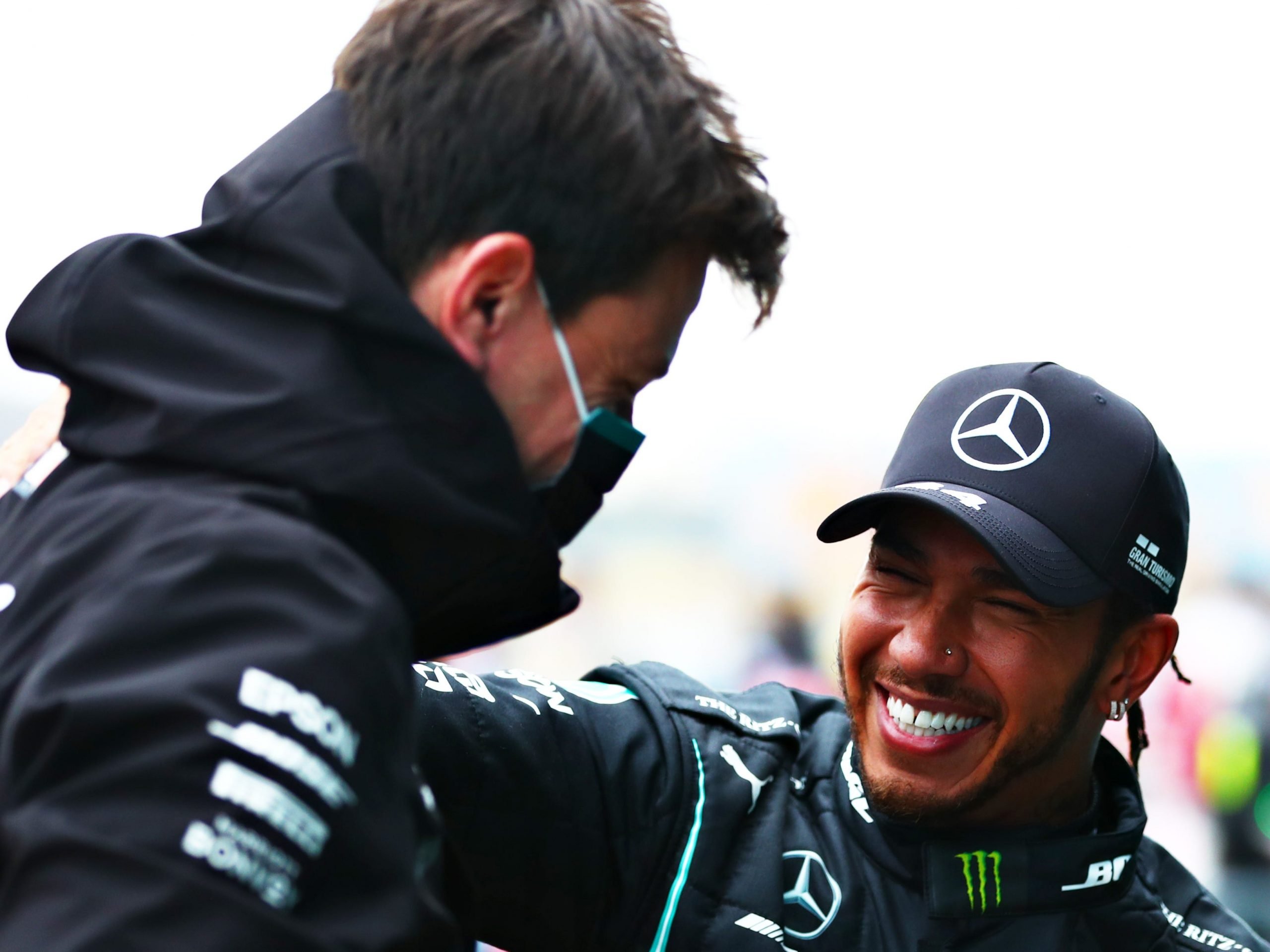 Lewis Hamilton smiles at Toto Wolff