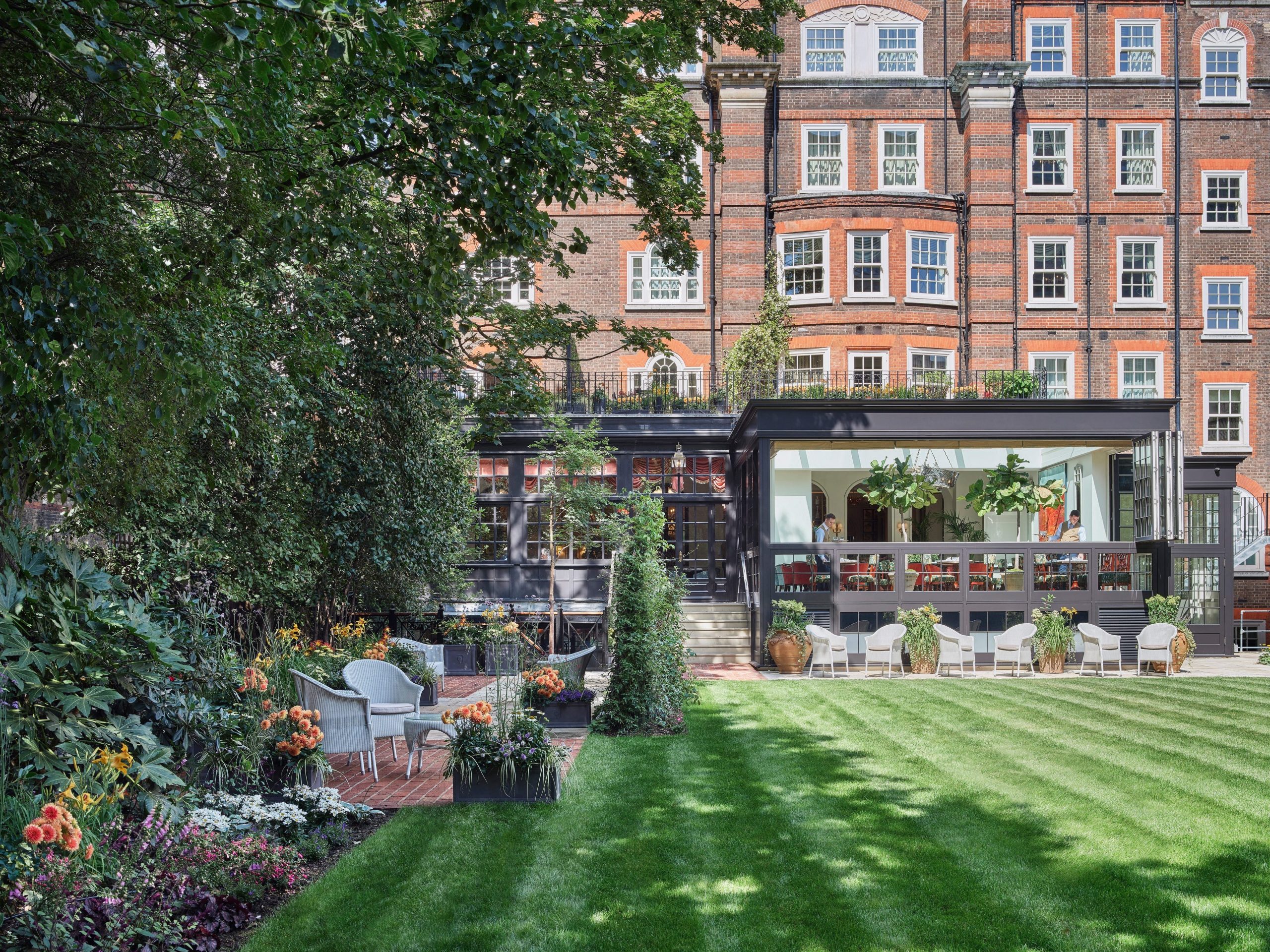 The exterior of the Goring Hotel and its courtyard garden in London.