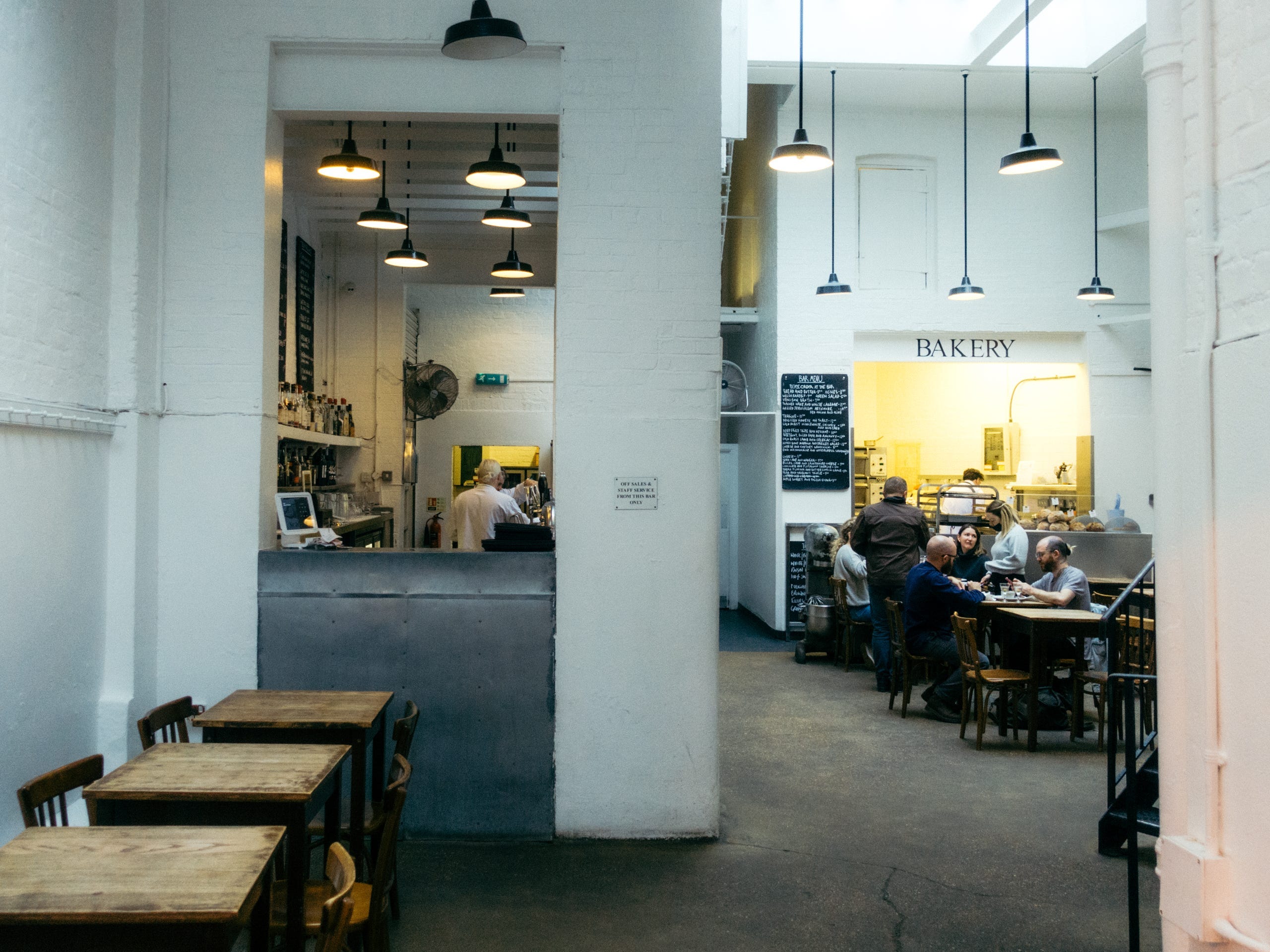 Inside the restaurant with tables at St. John in London.