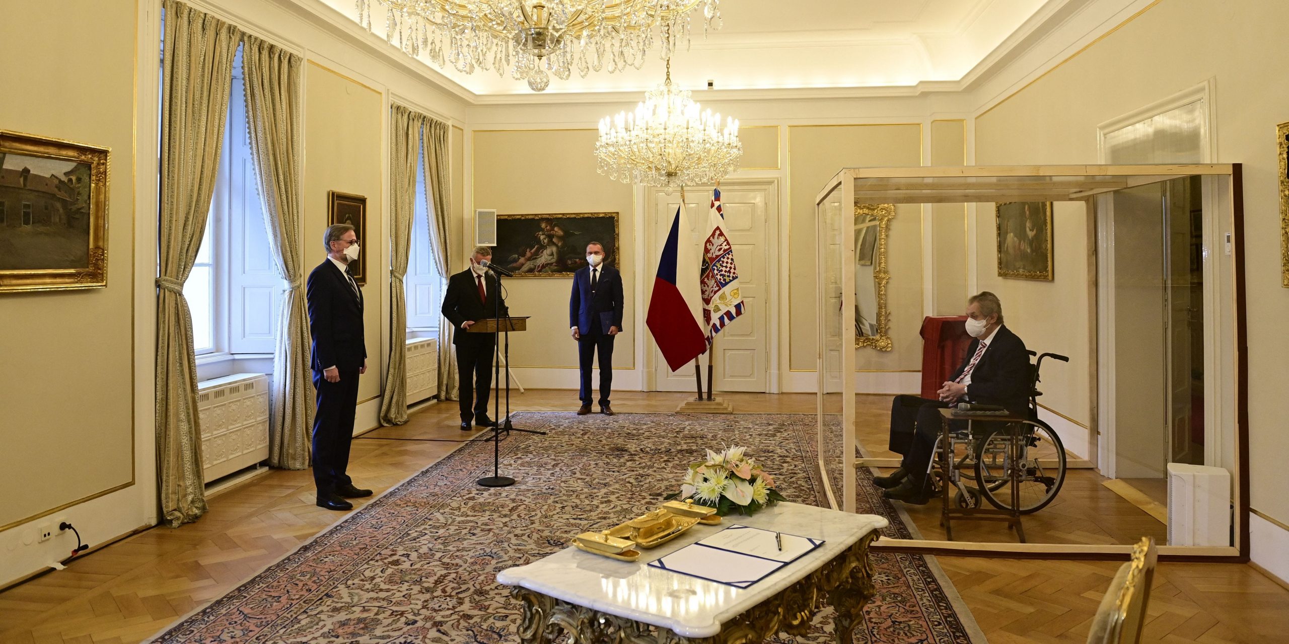 Covid-struck Czech President Milos Zeman, sits in a plastic cage as he appoints ODS leader Petr Fiala.