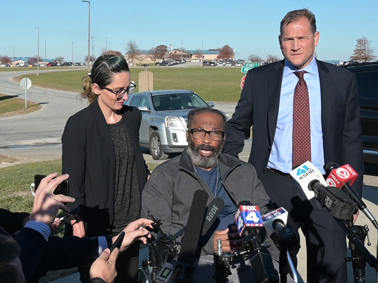 Kevin Strickland speaks in front of microphones at a press conference.